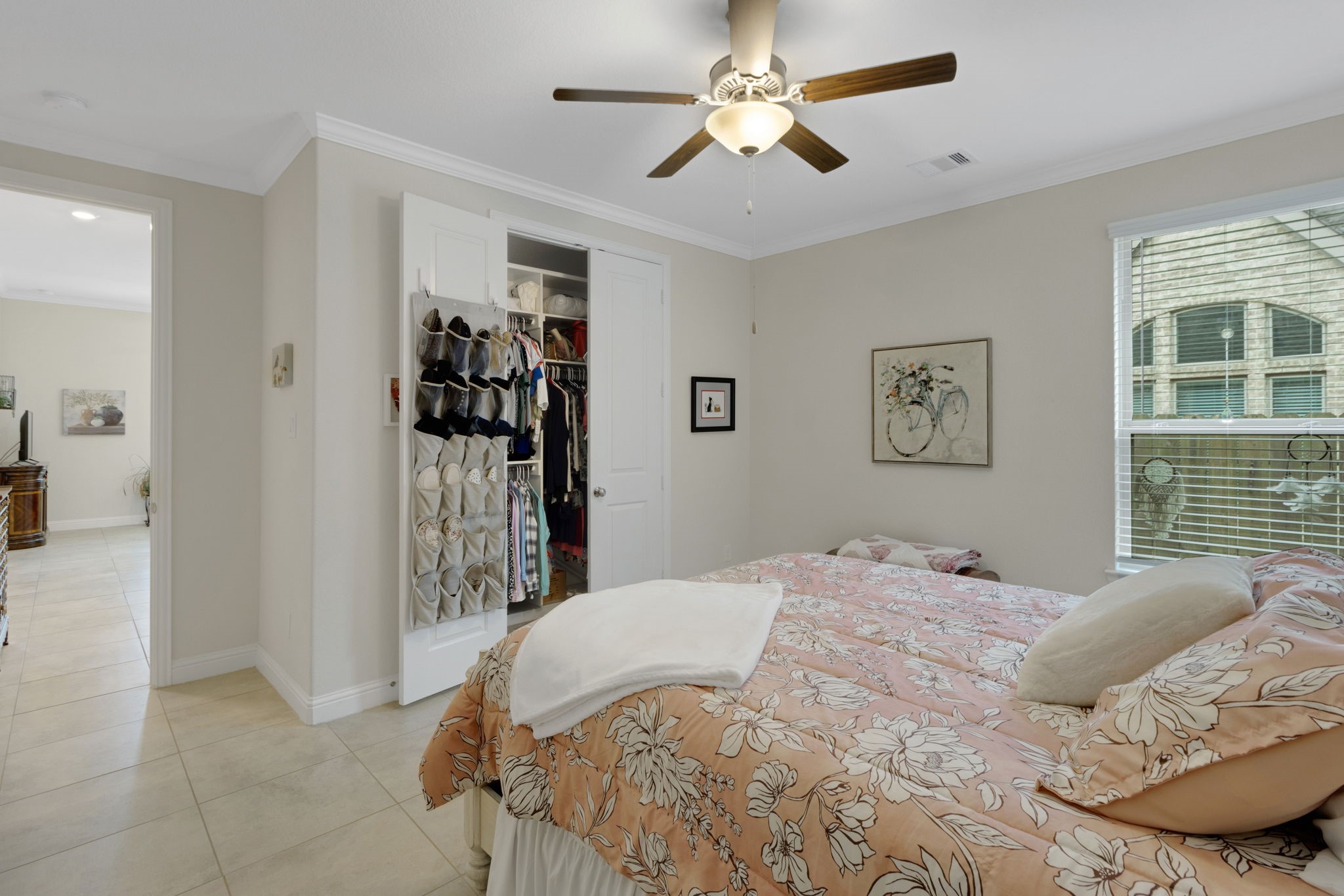 19248 Yellow Chestnut Lane New Caney, TX 77357 - Photo 32 of 42 a bedroom with a large bed and a window