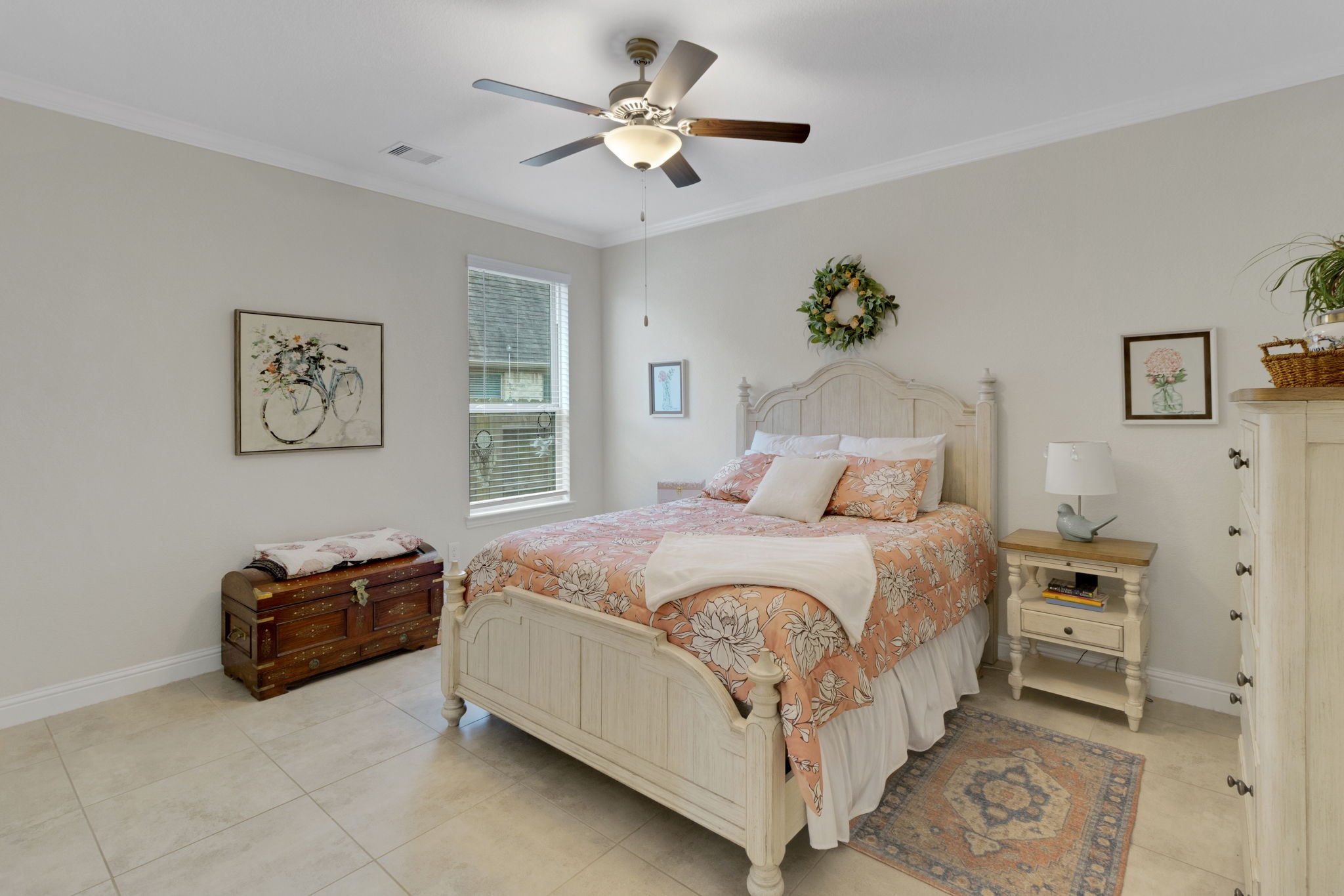 19248 Yellow Chestnut Lane New Caney, TX 77357 - Photo 36 of 42 a bedroom with a bed and a chandelier