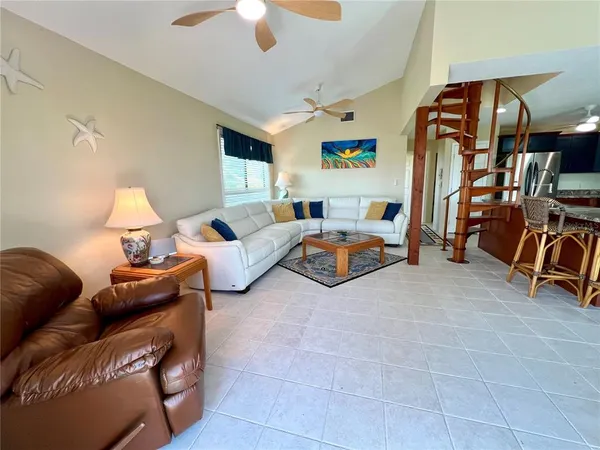 a view of a dining room with furniture and a livingroom