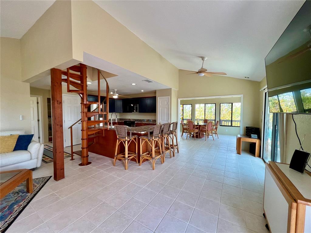 9580 Almirate Court Placida, FL 33946 - Photo 16 of 59 a living room with furniture and a flat screen tv