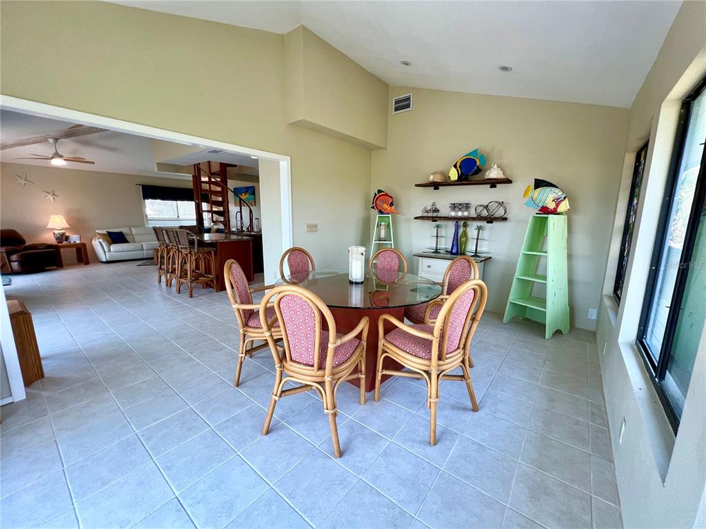 9580 Almirate Court Placida, FL 33946 - Photo 24 of 59 a dining room with furniture and a flat screen tv