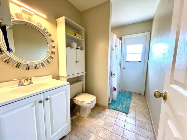 a spacious bedroom with a bed and a window