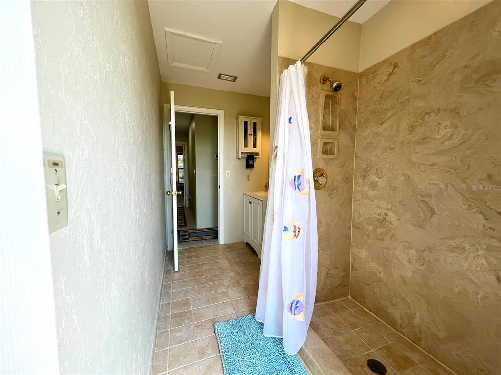 9580 Almirate Court Placida, FL 33946 - Photo 27 of 59 a bathroom with a shower and a sink
