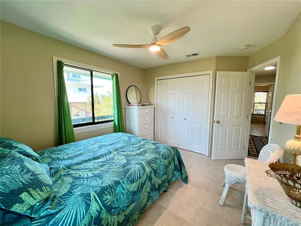 a bedroom with a bed and a dresser