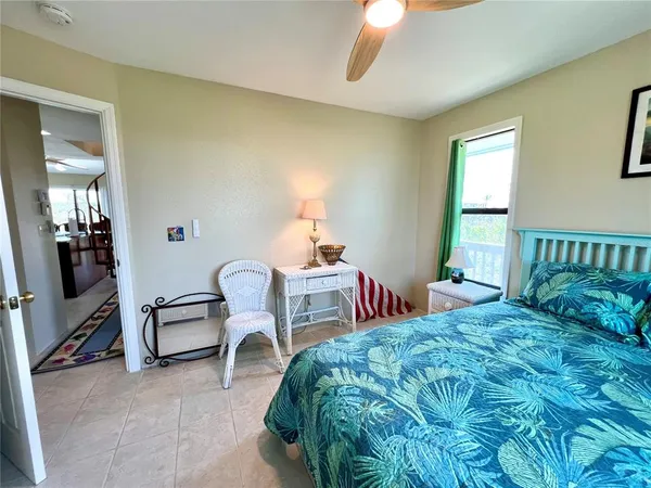 a bedroom with a bed and a couch