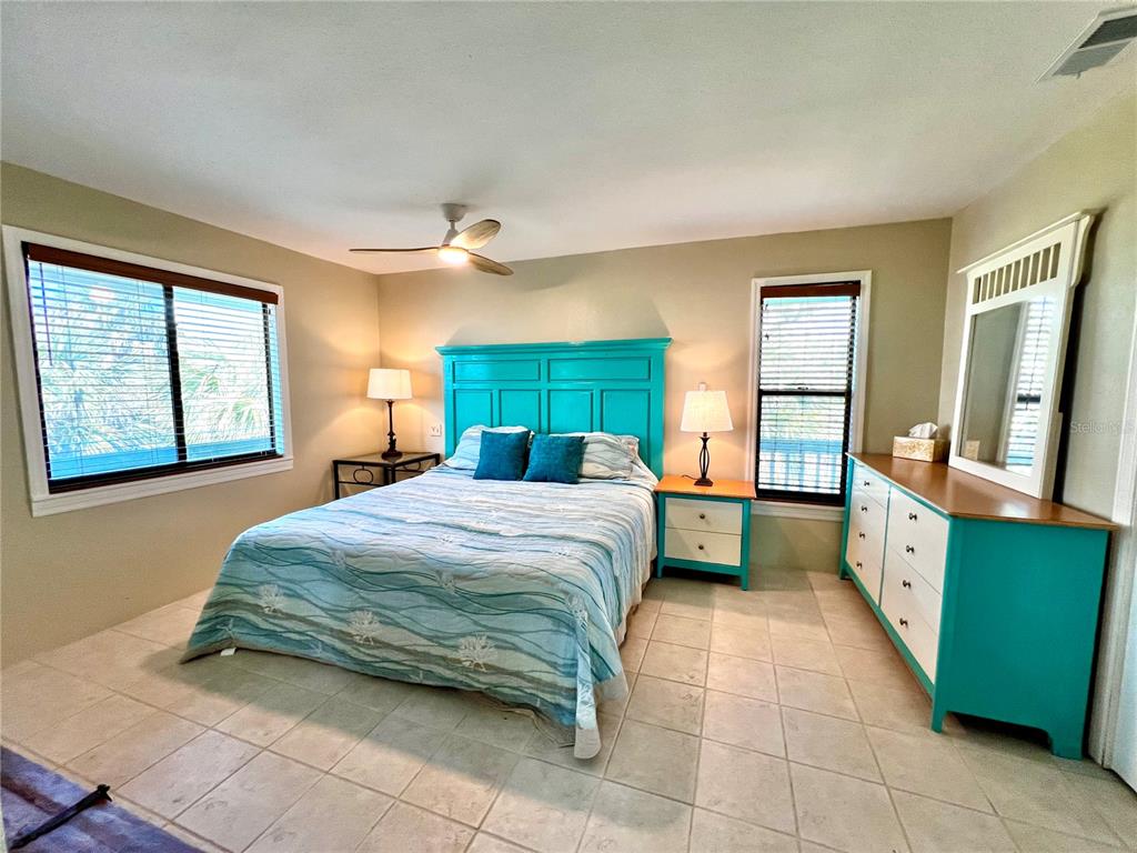 9580 Almirate Court Placida, FL 33946 - Photo 32 of 59 a bedroom with a bed and a dresser