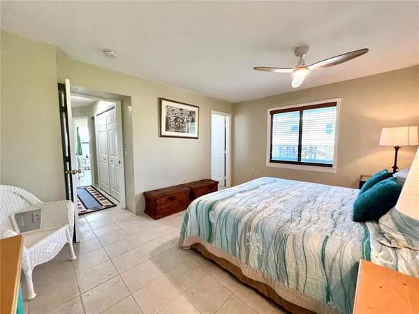 a bedroom with furniture and a window