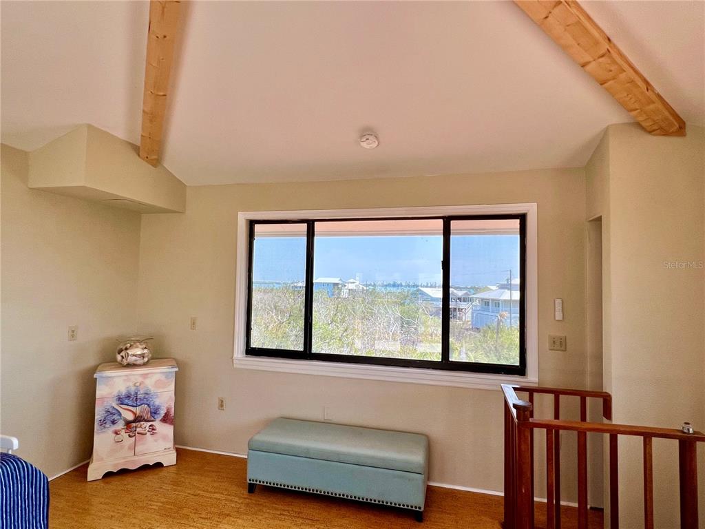 9580 Almirate Court Placida, FL 33946 - Photo 39 of 59 a living room with furniture and a large window