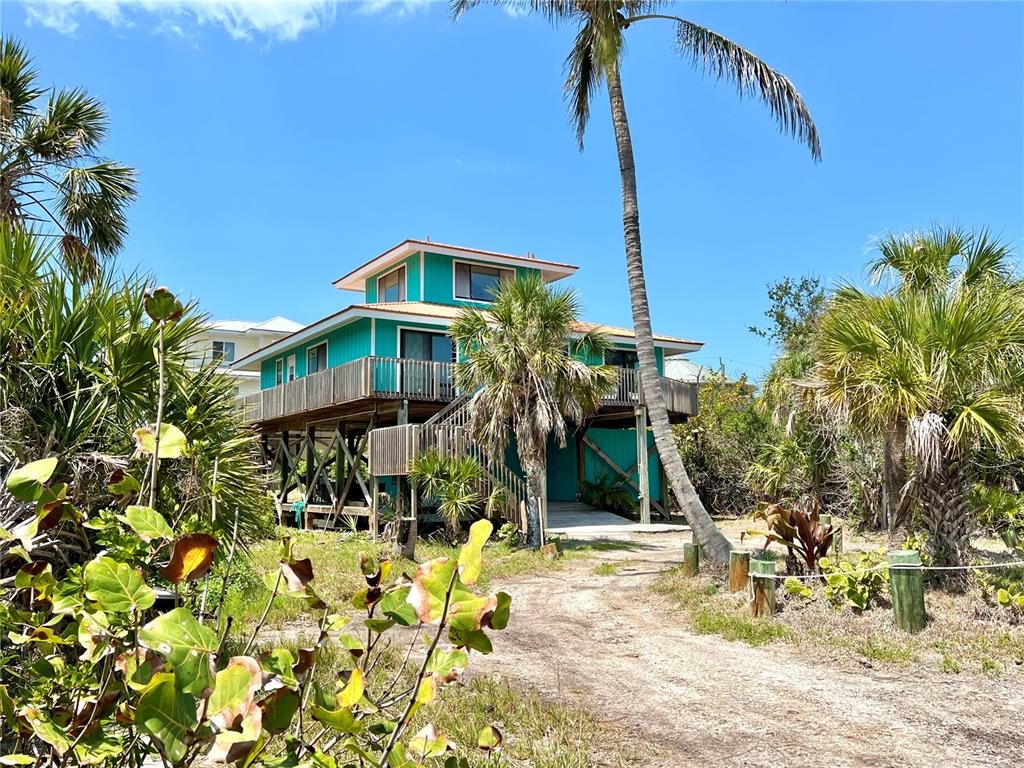 9580 Almirate Court Placida, FL 33946 - Photo 4 of 59 a front view of a house with a yard