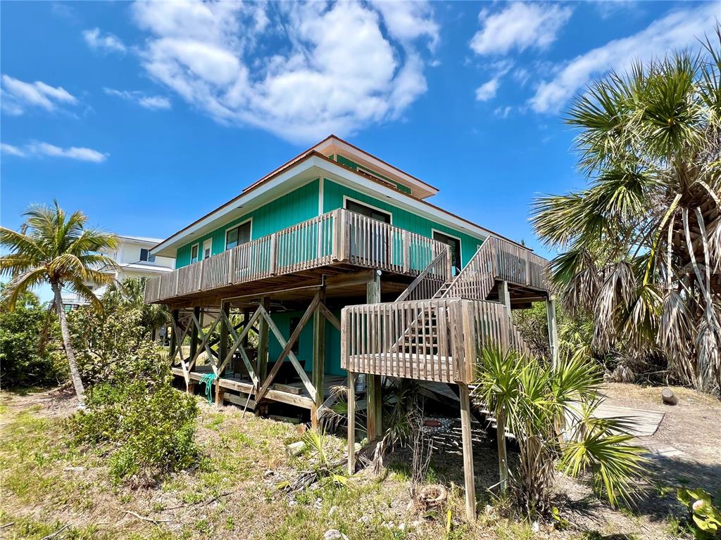 9580 Almirate Court Placida, FL 33946 - Photo 5 of 59 a front view of a house with garden