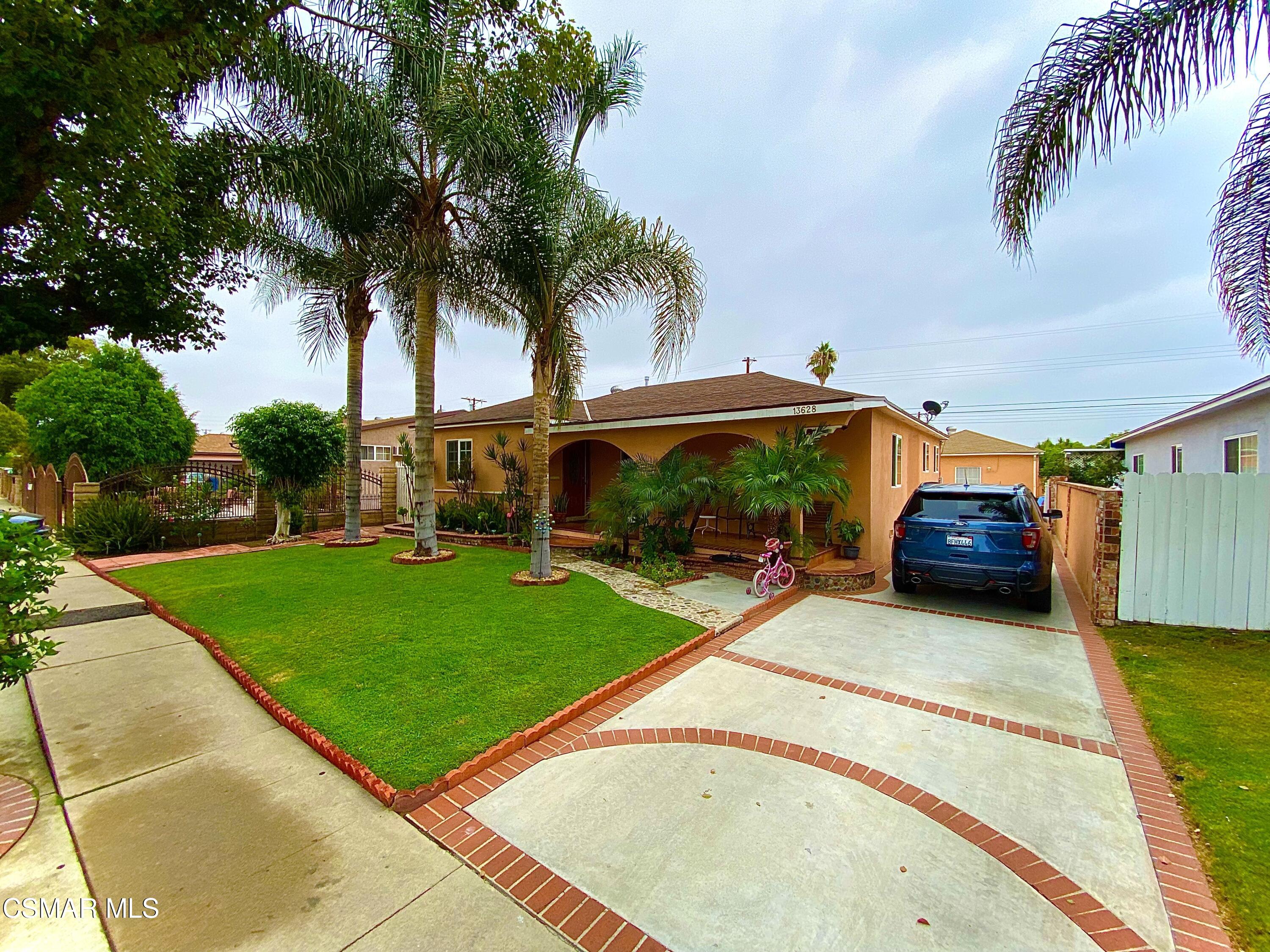 a view of a backyard with a car parked