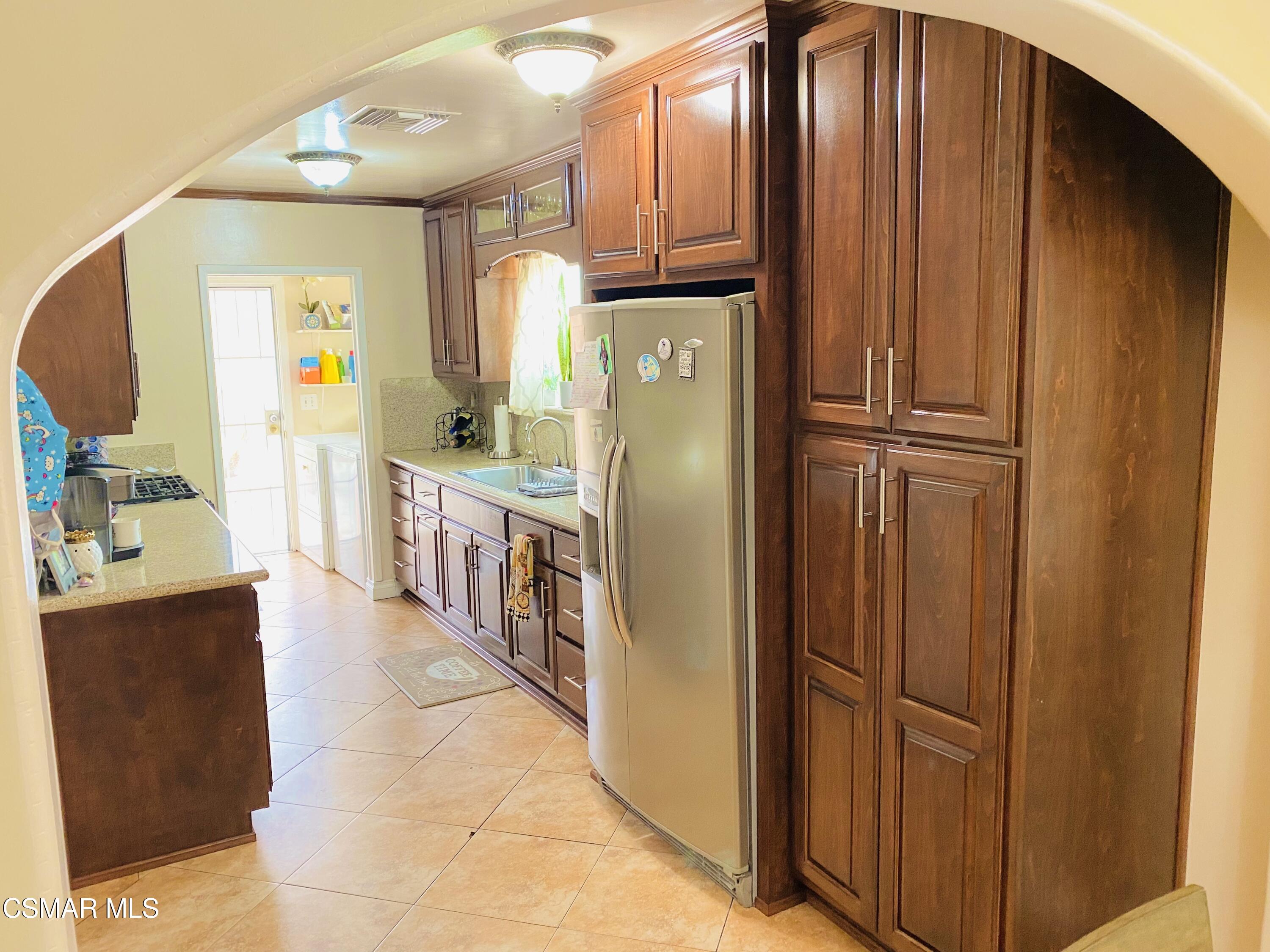 13628 Wingo Street Arleta, CA 91331 - Photo 12 of 55 a kitchen with stainless steel appliances granite countertop a refrigerator and a stove