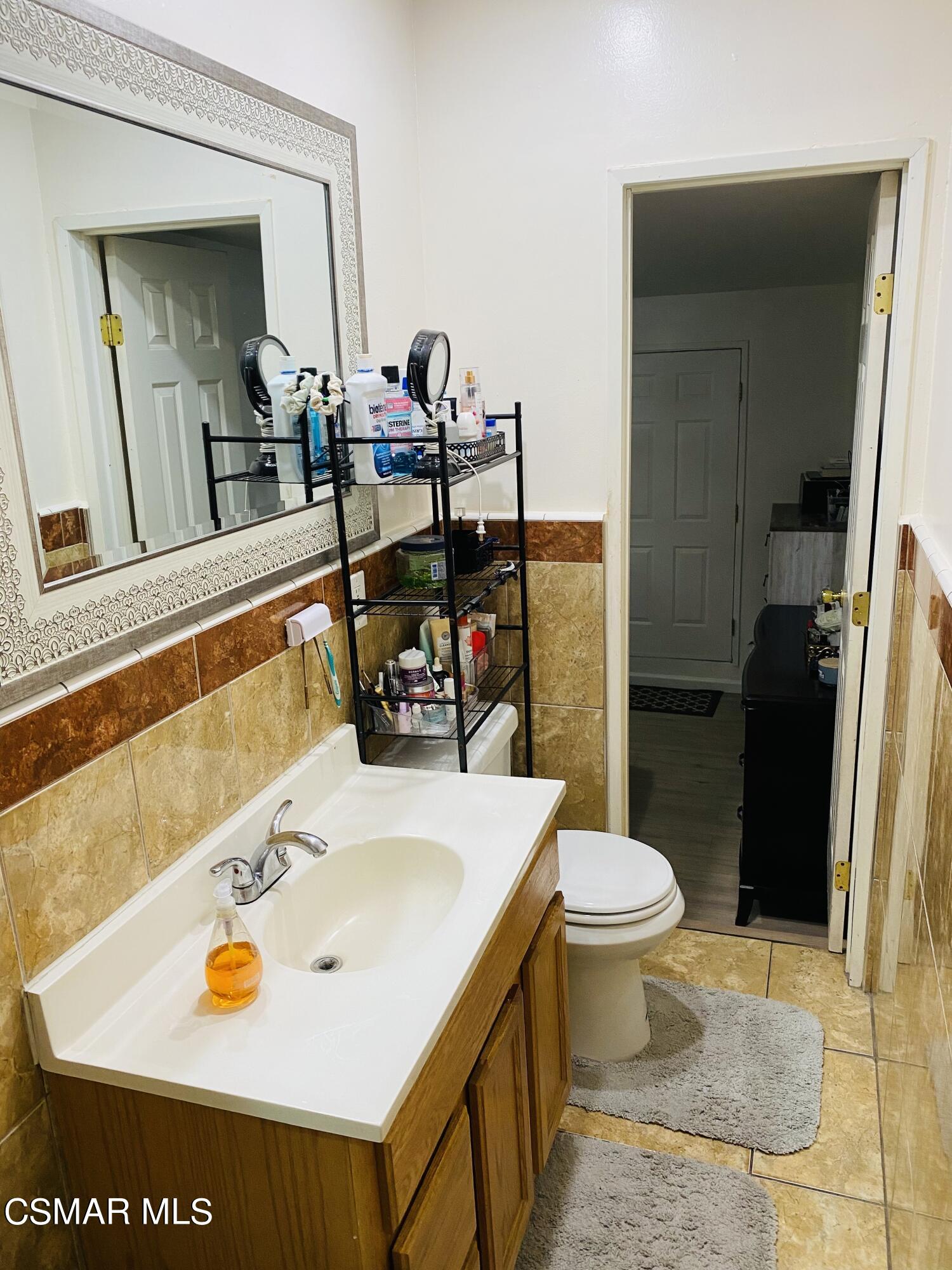 13628 Wingo Street Arleta, CA 91331 - Photo 20 of 55 a bathroom with a sink and a toilet