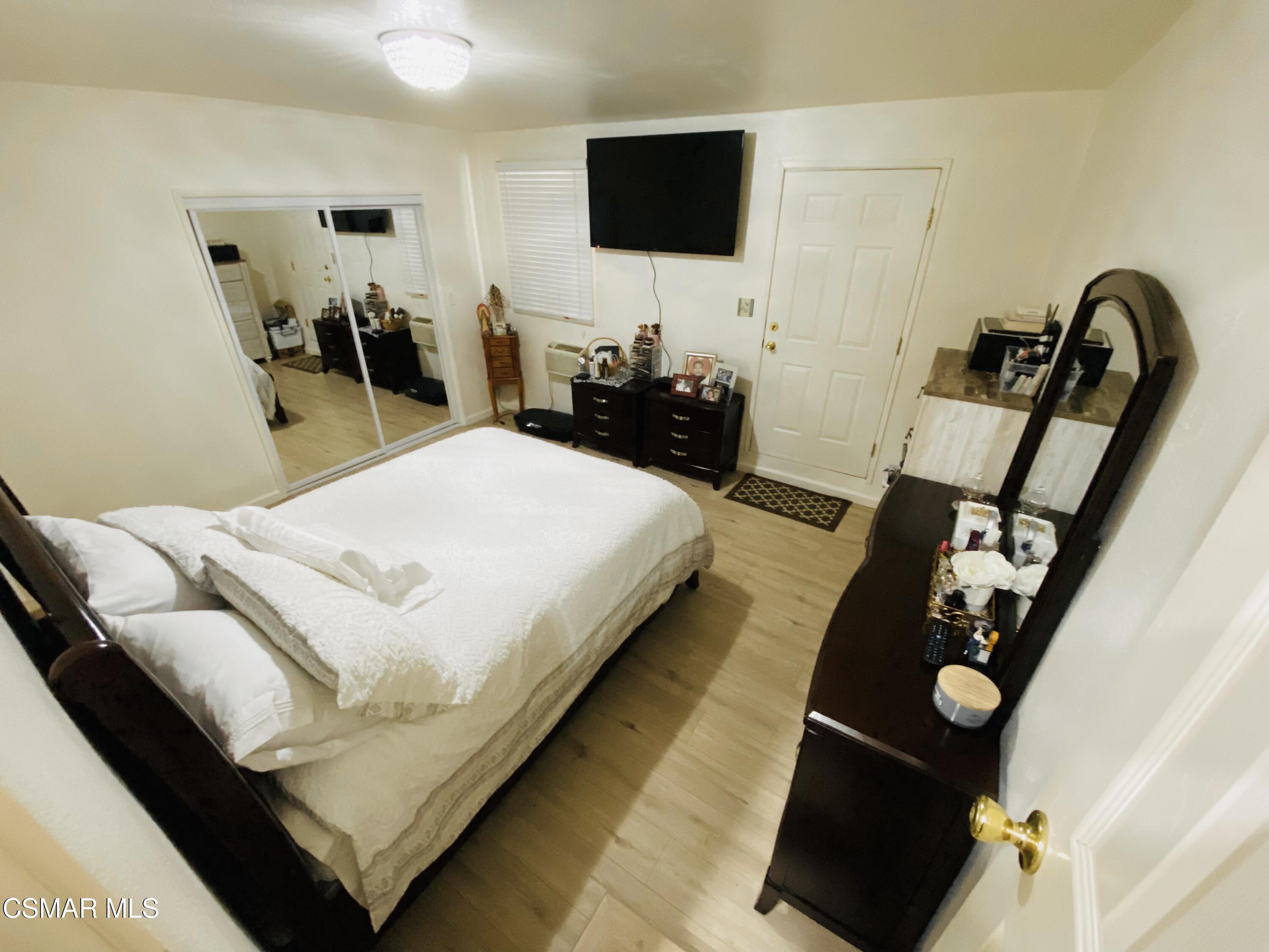 13628 Wingo Street Arleta, CA 91331 - Photo 23 of 55 a living room with furniture and a flat screen tv