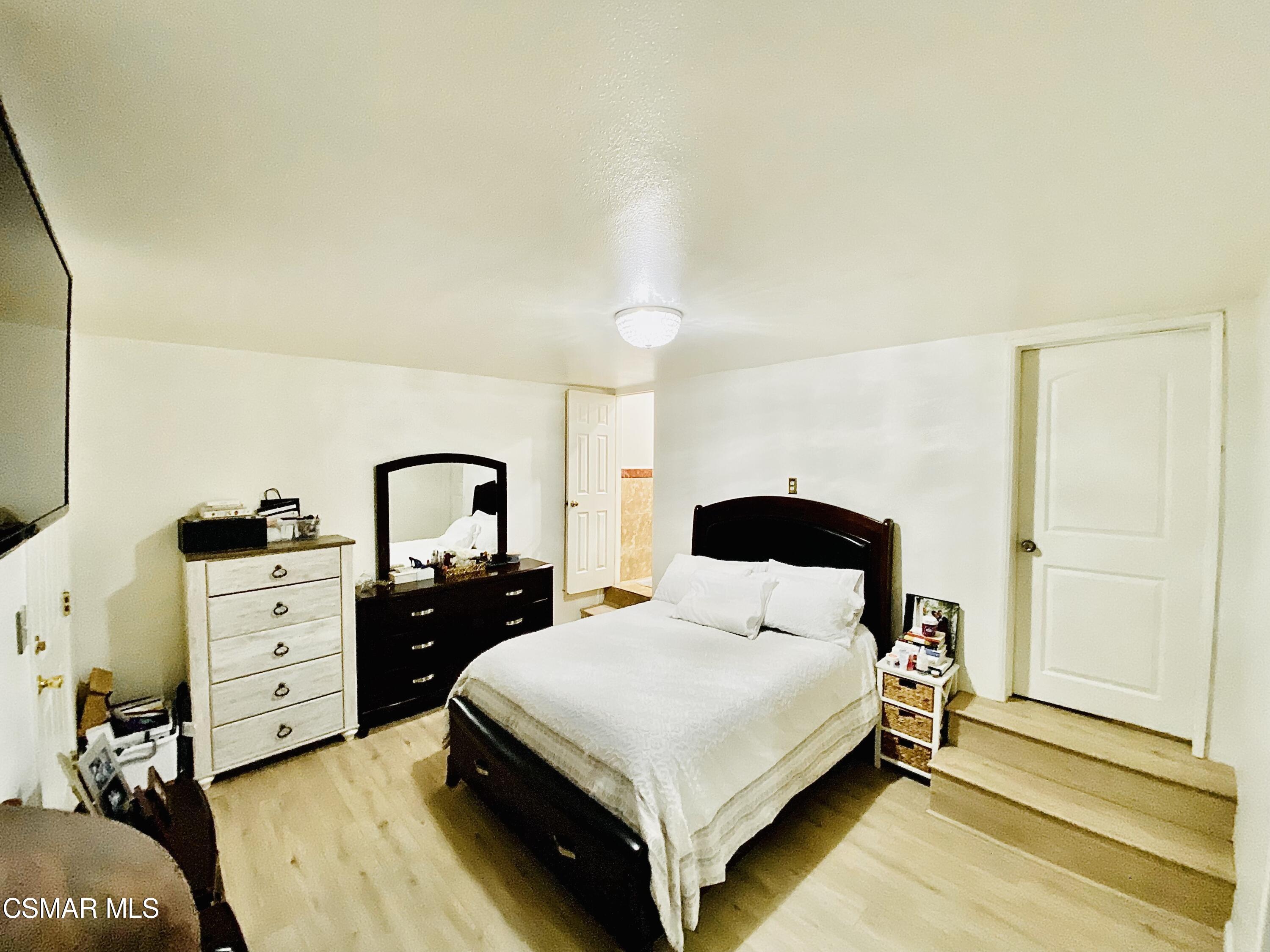 13628 Wingo Street Arleta, CA 91331 - Photo 24 of 55 a bedroom with a bed and a desk