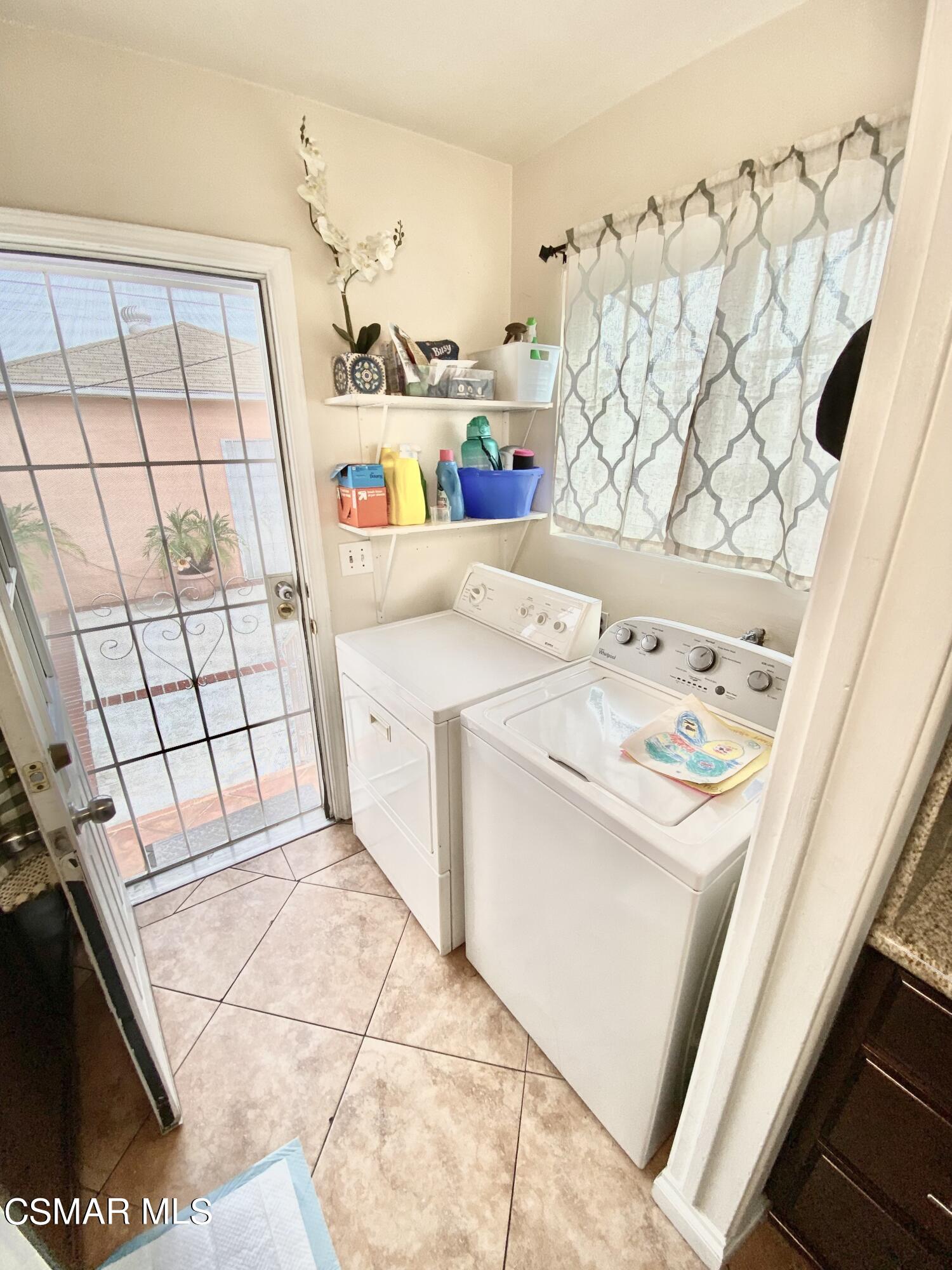 13628 Wingo Street Arleta, CA 91331 - Photo 25 of 55 a utility room with dryer and washer