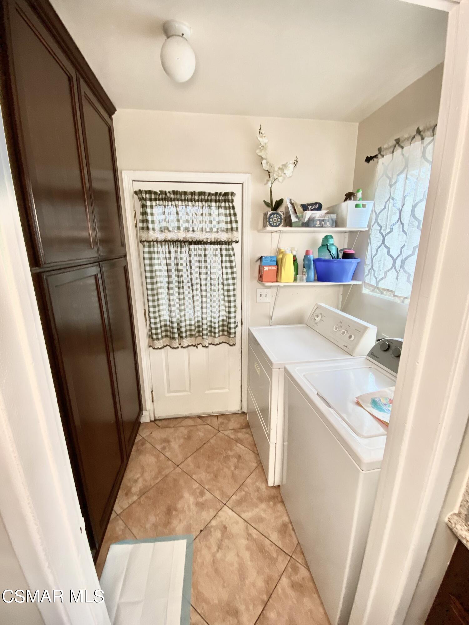 13628 Wingo Street Arleta, CA 91331 - Photo 26 of 55 a utility room with dryer and washer