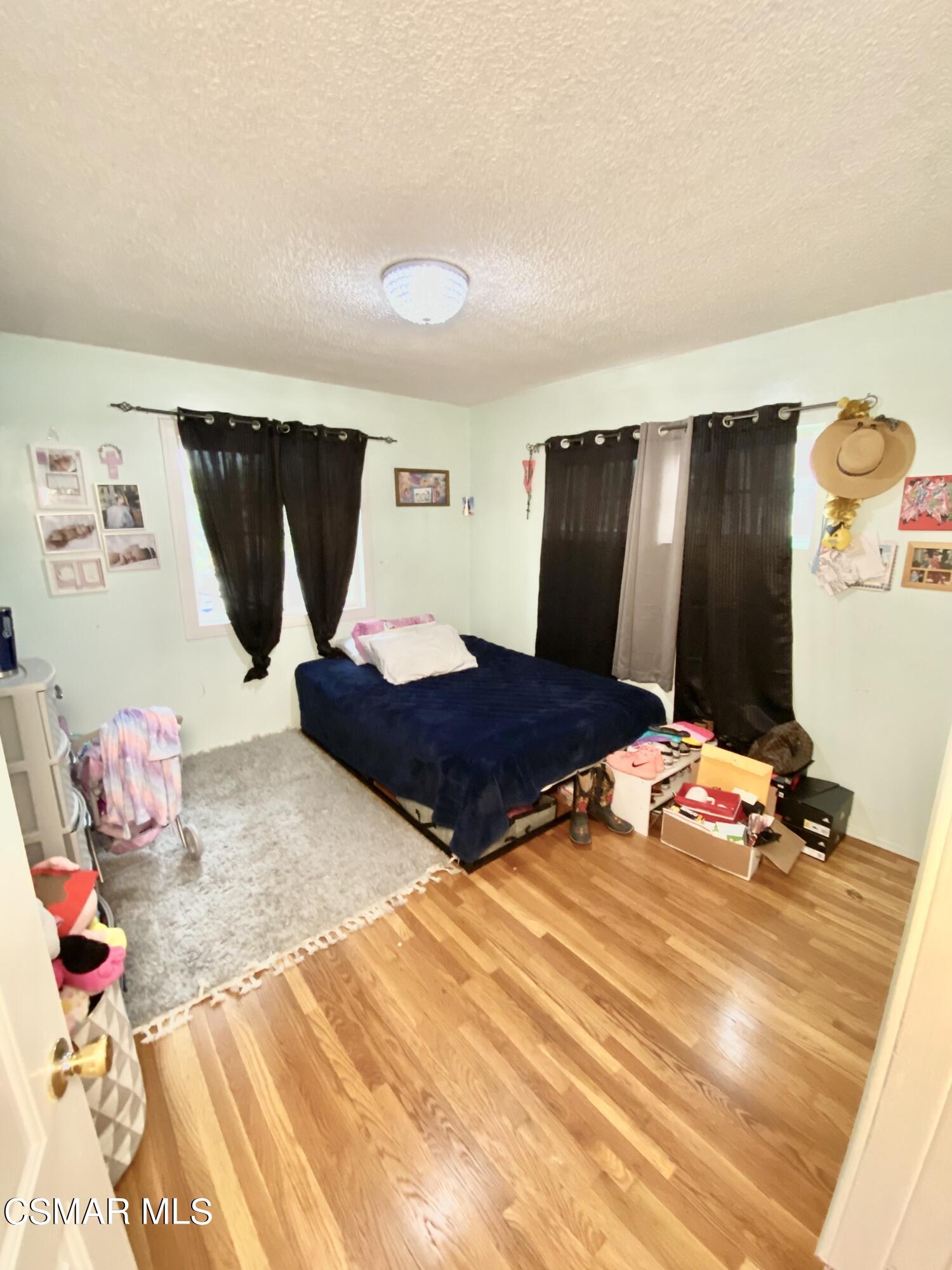 13628 Wingo Street Arleta, CA 91331 - Photo 28 of 55 a bedroom with a bed and dresser