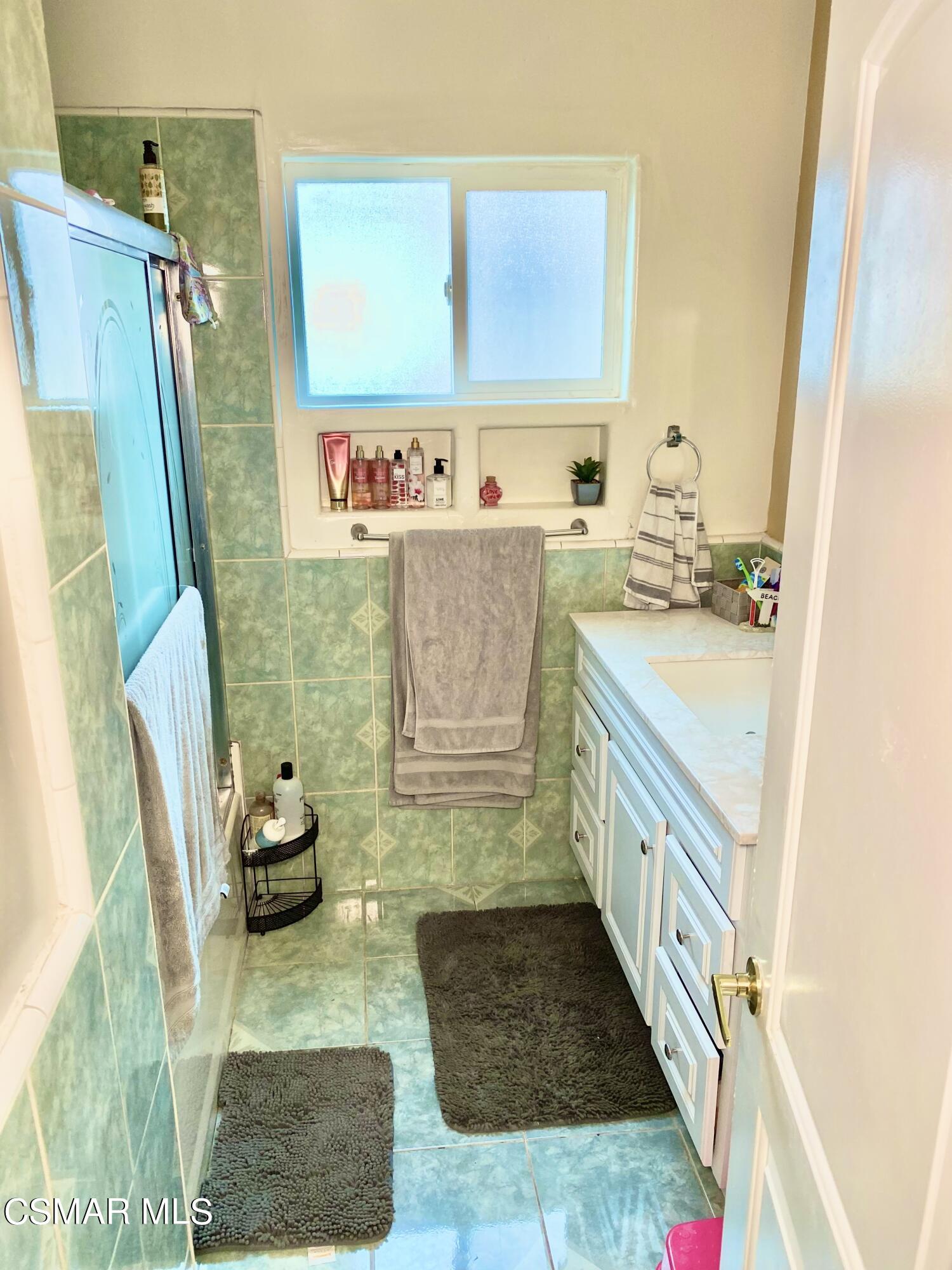 13628 Wingo Street Arleta, CA 91331 - Photo 33 of 55 a bathroom with sink granite and a mirror