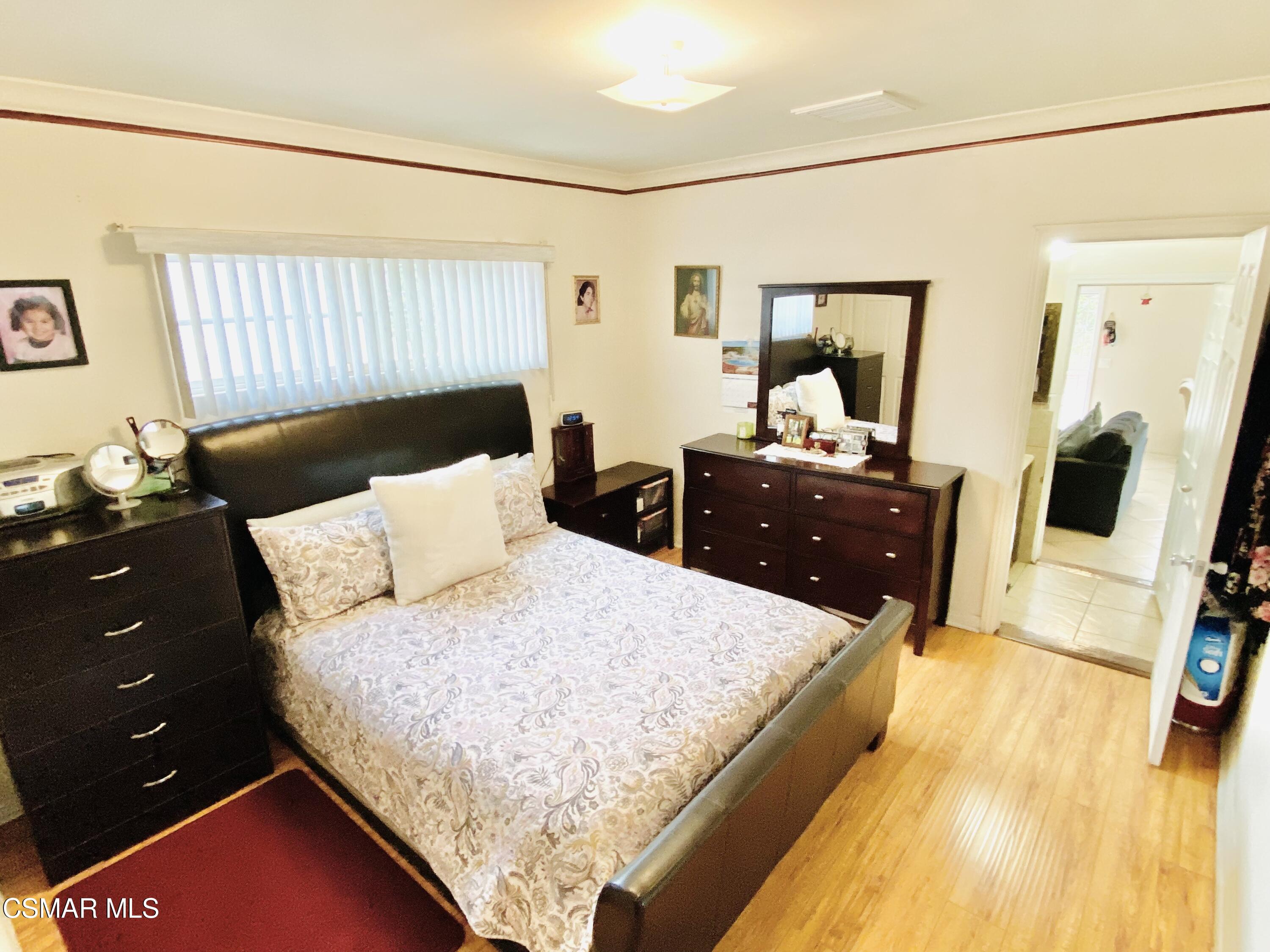 13628 Wingo Street Arleta, CA 91331 - Photo 48 of 55 a living room with a bed and furniture