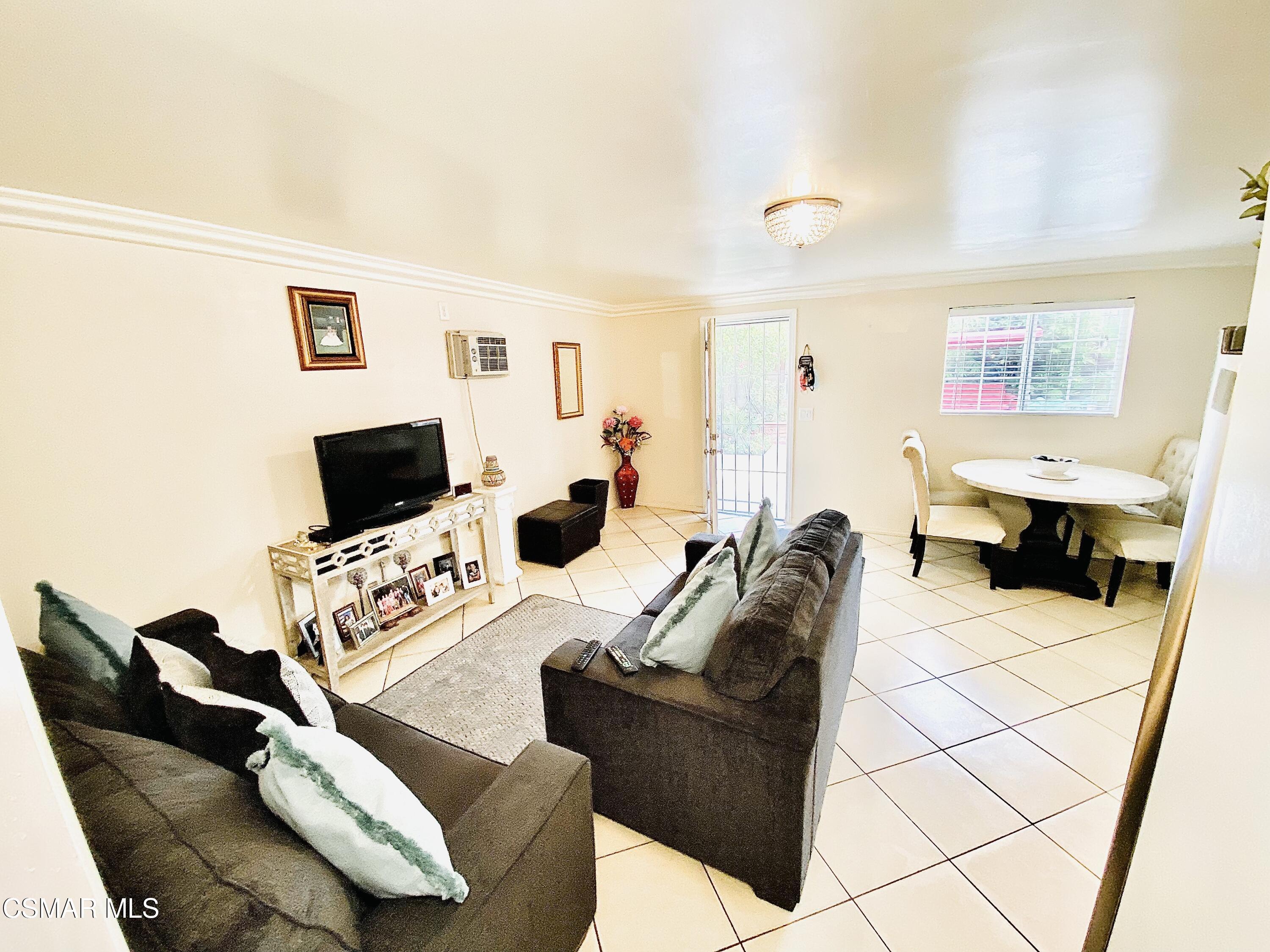 13628 Wingo Street Arleta, CA 91331 - Photo 55 of 55 a living room with furniture and a flat screen tv