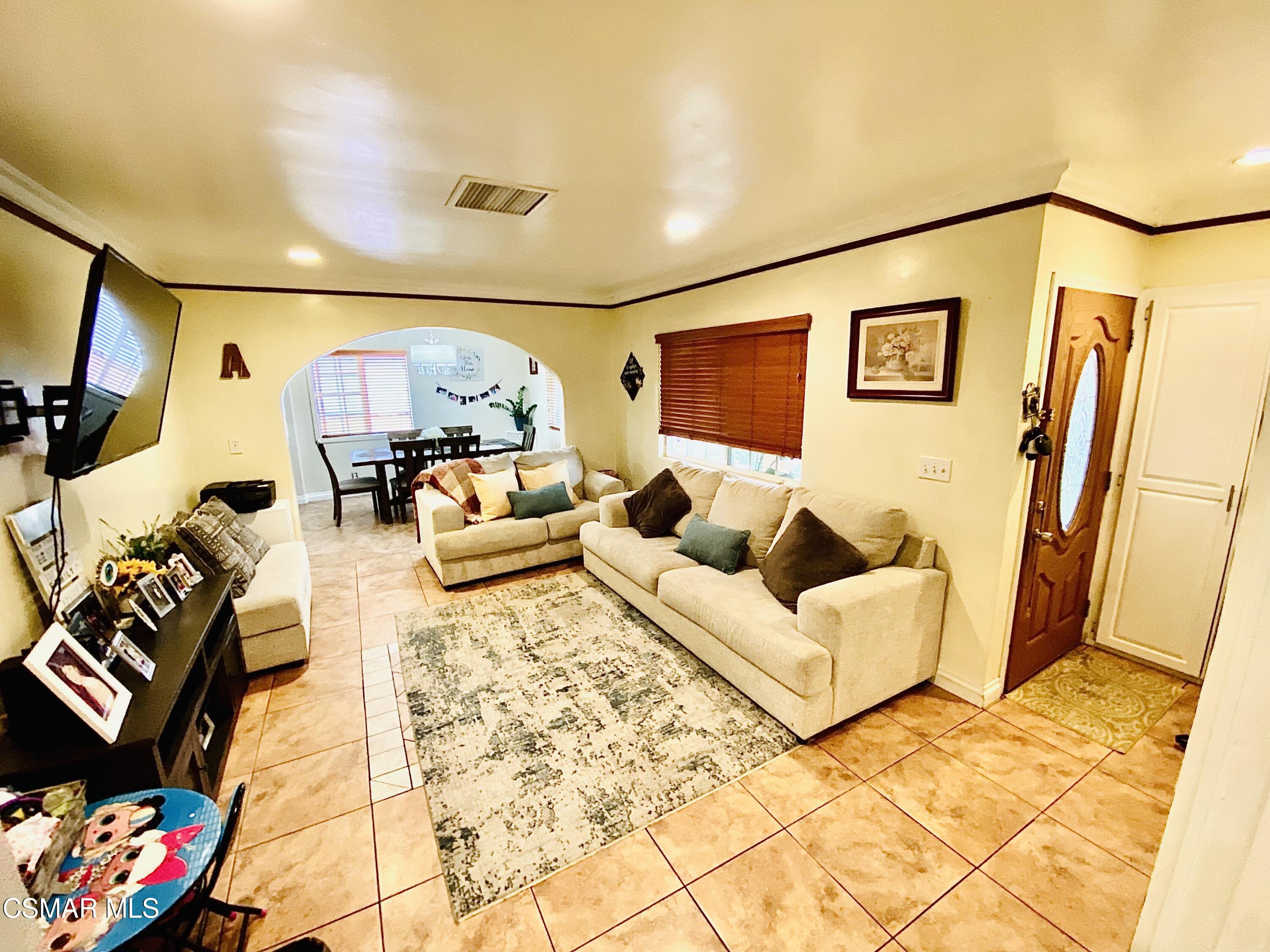 13628 Wingo Street Arleta, CA 91331 - Photo 7 of 55 a living room with furniture and a flat screen tv