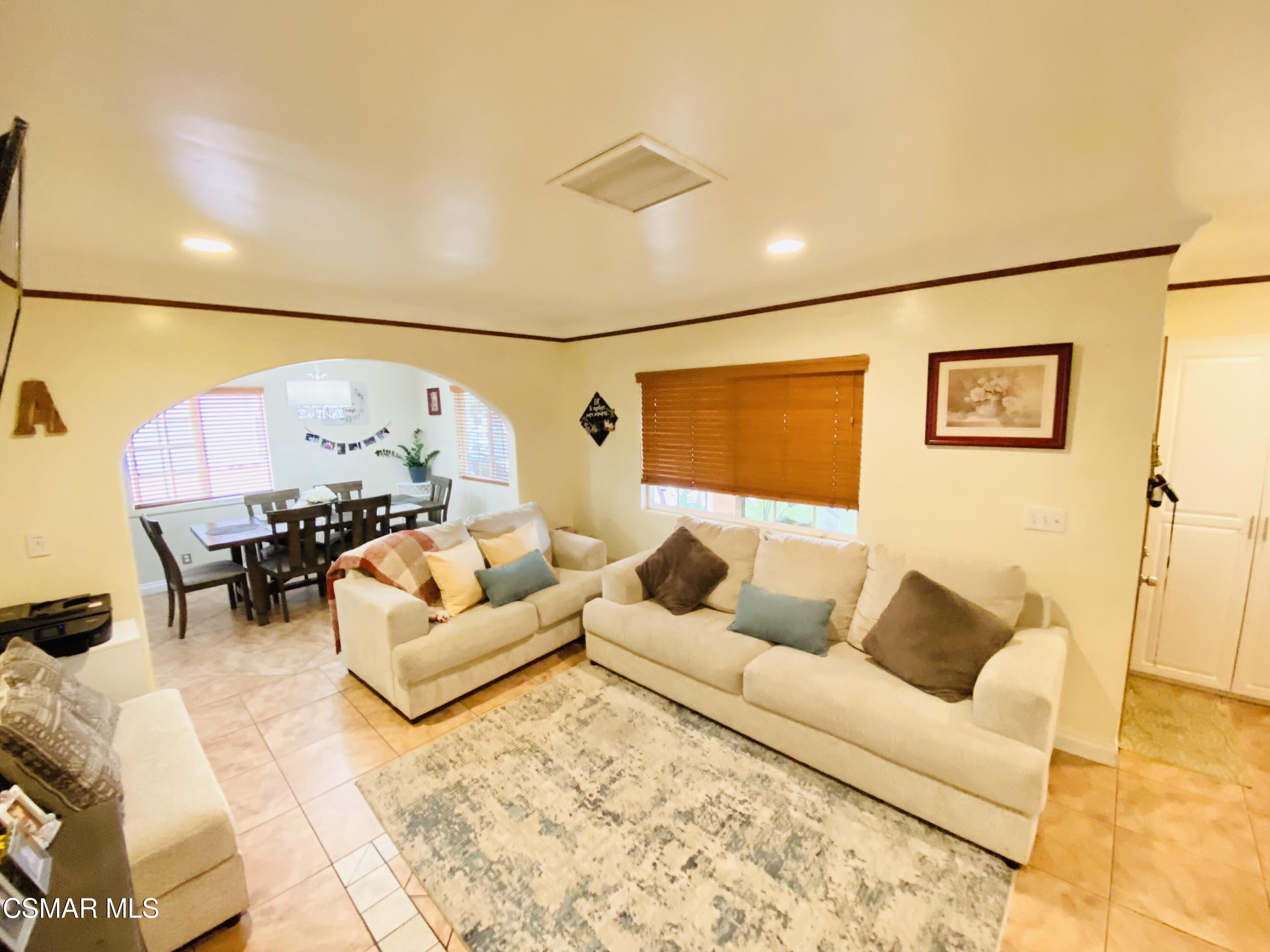 13628 Wingo Street Arleta, CA 91331 - Photo 9 of 55 a living room with furniture and a large window