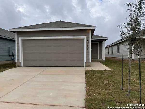 a front view of a house with parking space