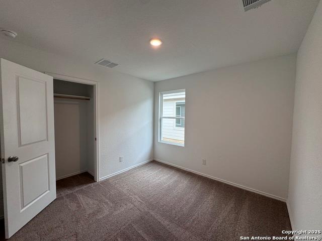 13722 Appleton Way San Antonio, TX 78253 - Photo 7 of 22 Unfurnished bedroom featuring carpet flooring, a closet, and recessed lighting