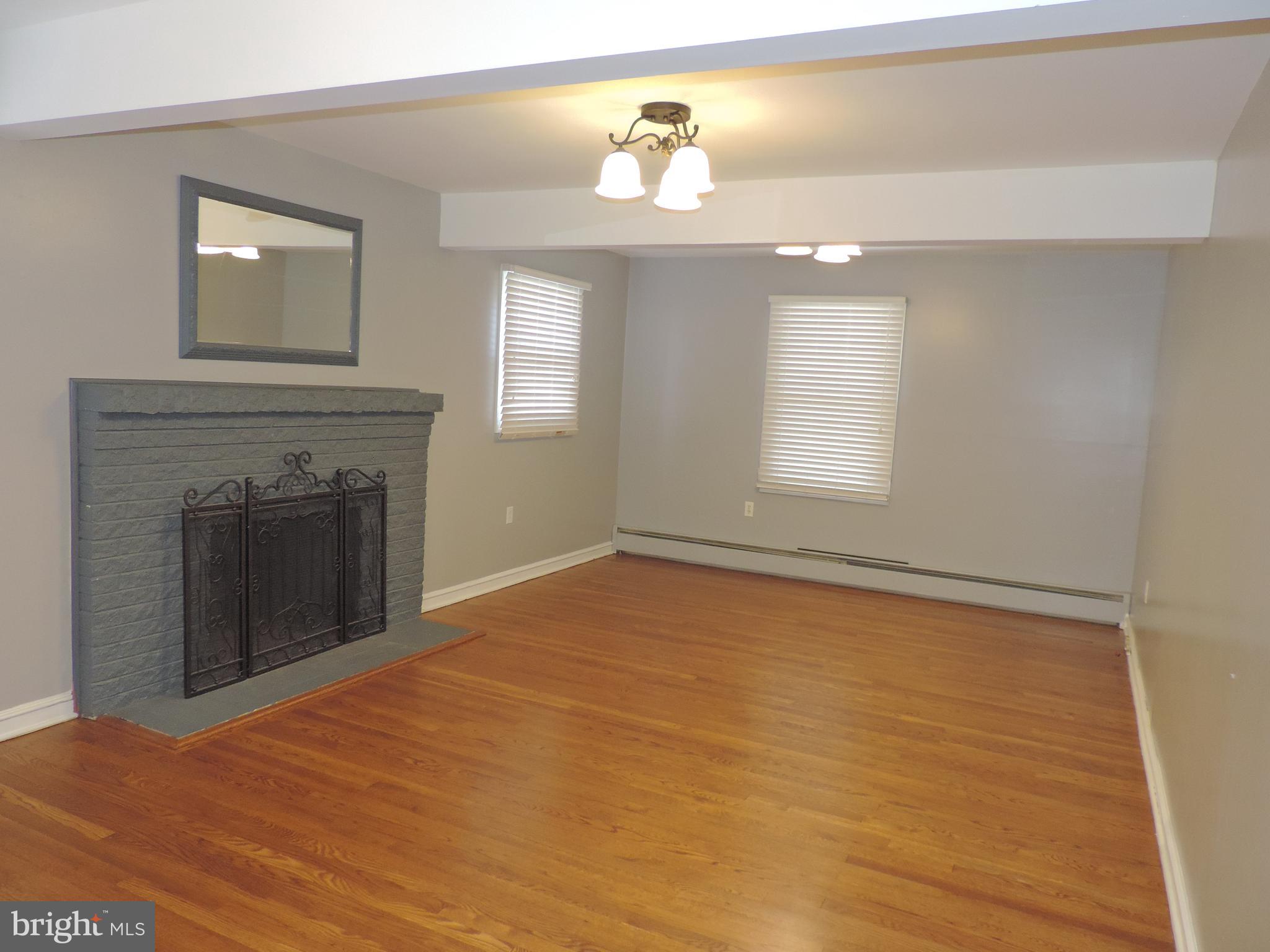 607 Paradise Road Aberdeen, MD 21001 - Photo 3 of 39 Spacious Living Room with wood burning fireplace