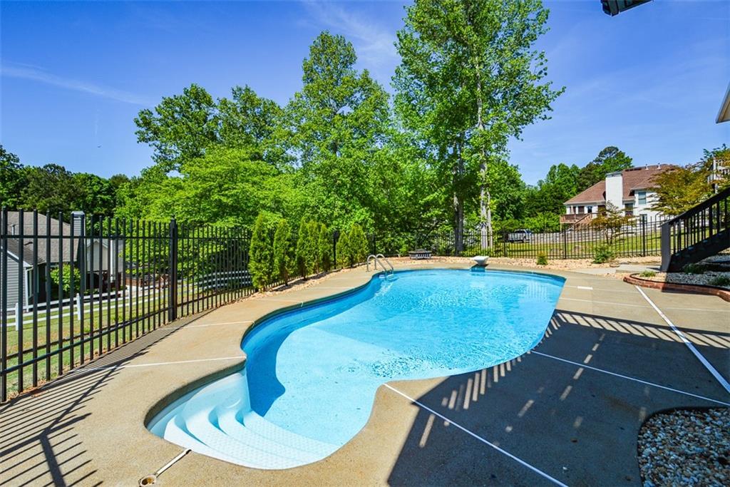 10 Arbor Hills Road South Talking Rock, GA 30175 - Photo 58 of 89 a view of a swimming pool with an outdoor seating