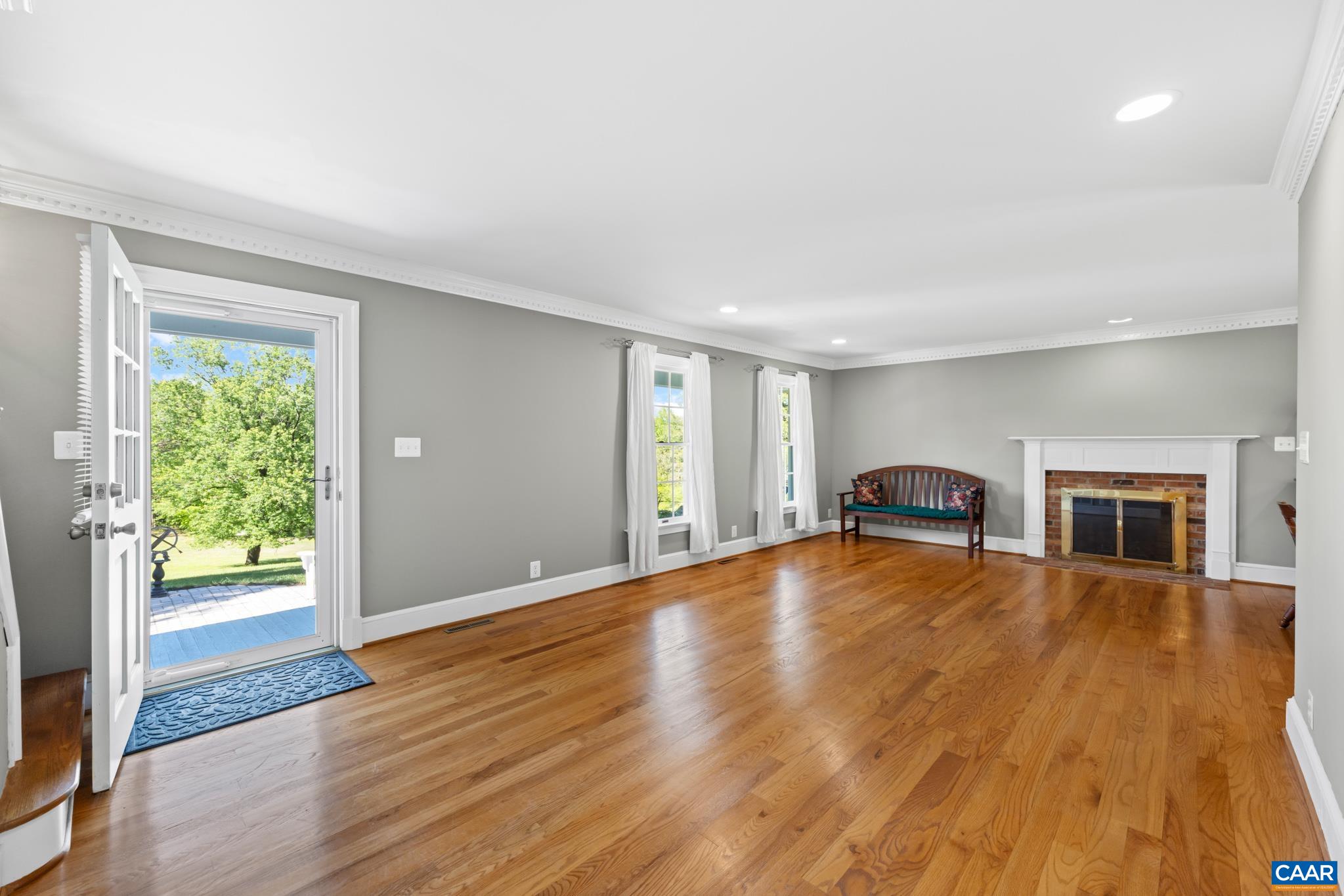 480 Dawsonville Road Barboursville, VA 22923 - Photo 4 of 55 a view of empty room with wooden floor and fireplace