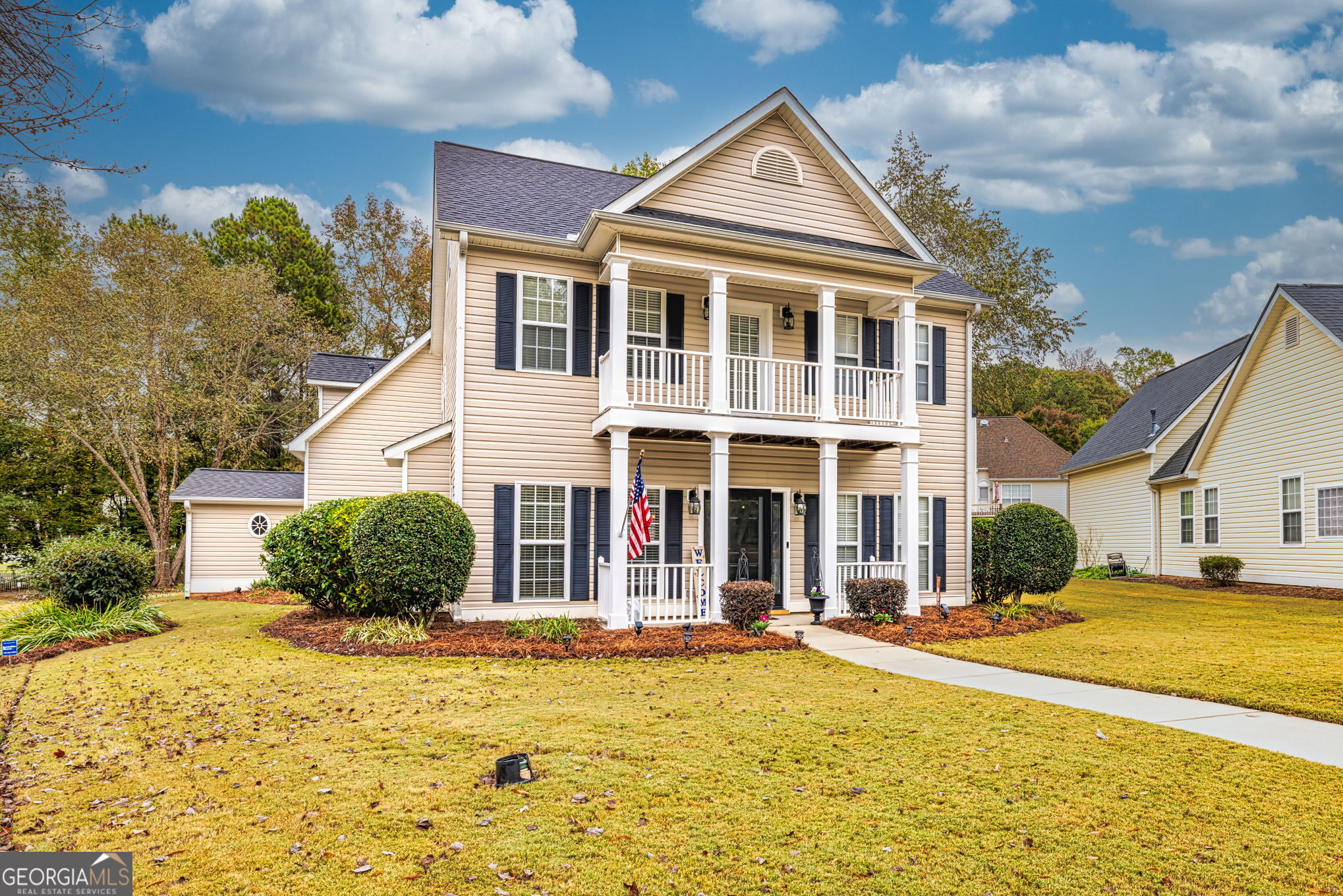 a front view of a house with a yard
