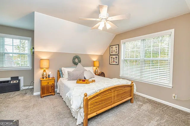 a bedroom with a bed and window