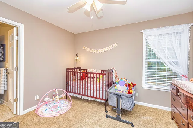 a bedroom with furniture and a window
