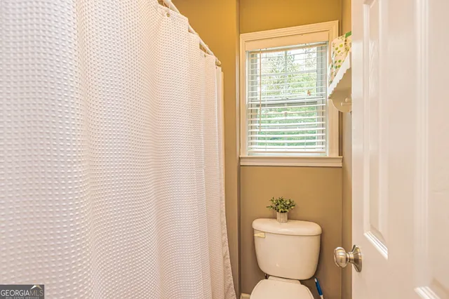 a bathroom with a toilet and a sink