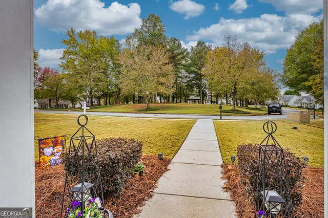 a view of a swimming pool and a patio