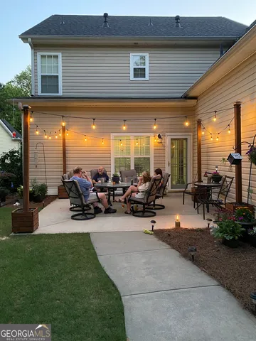 a view of a gym with table and chairs