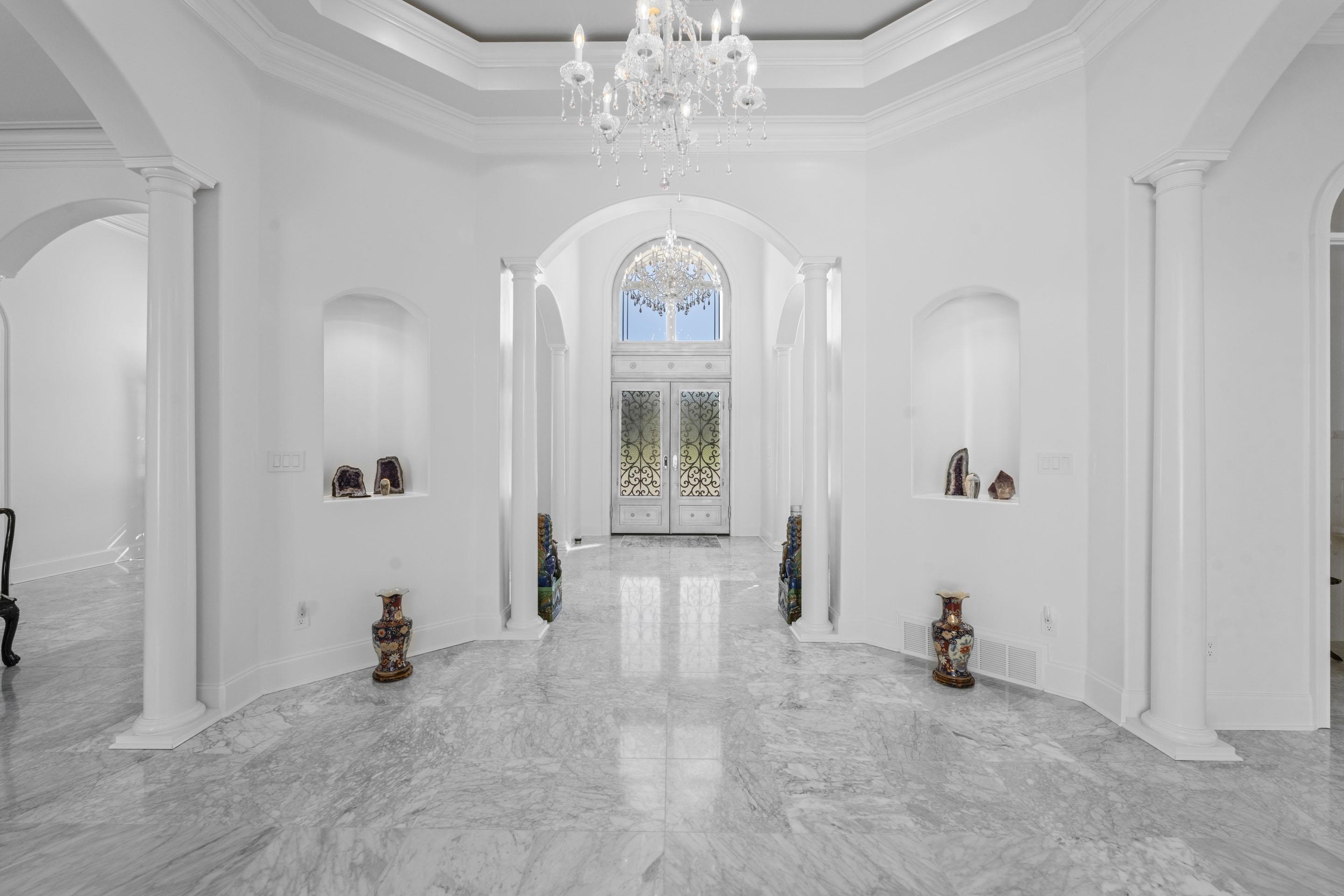 881 Bray Station Road Collierville, TN 38017 - Photo 2 of 40 Hall featuring arched walkways, ornate columns, marble tiled flooring, a towering ceiling, and ornamental molding