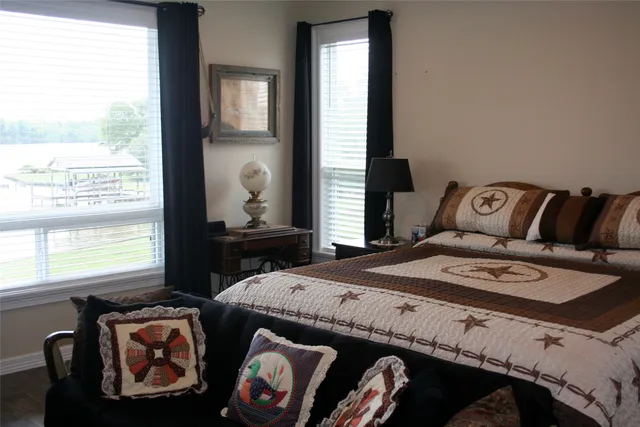 a bedroom with a bed and window