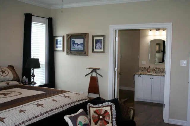 a bedroom with a bed and a mirror