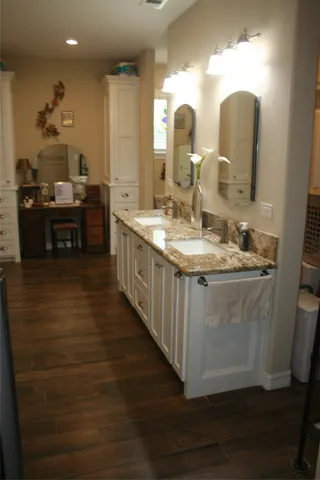 a kitchen with sink and cabinets