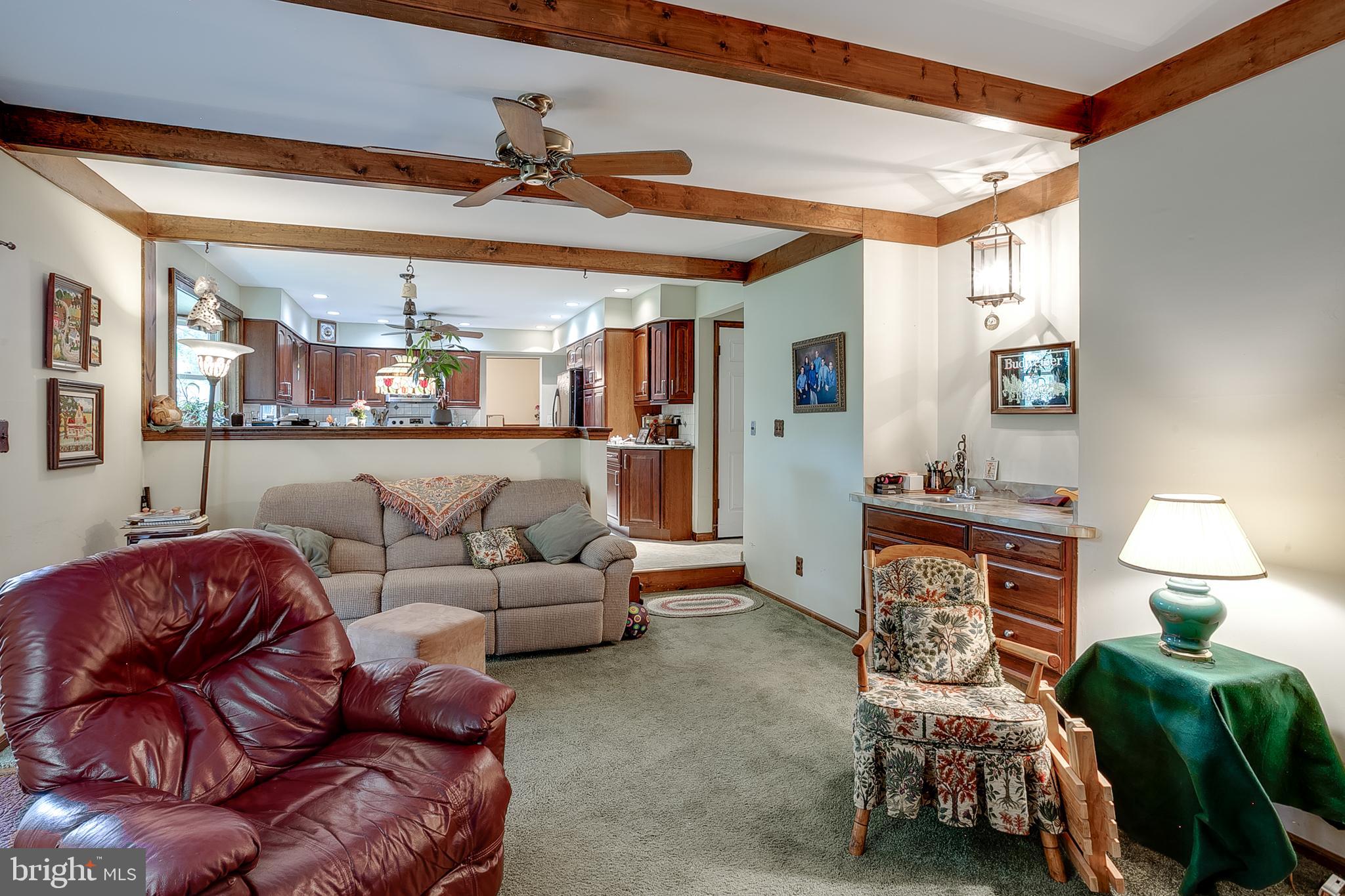 402 Doerrmann Drive Mickleton, NJ 08056 - Photo 13 of 34 a living room with furniture and a chandelier