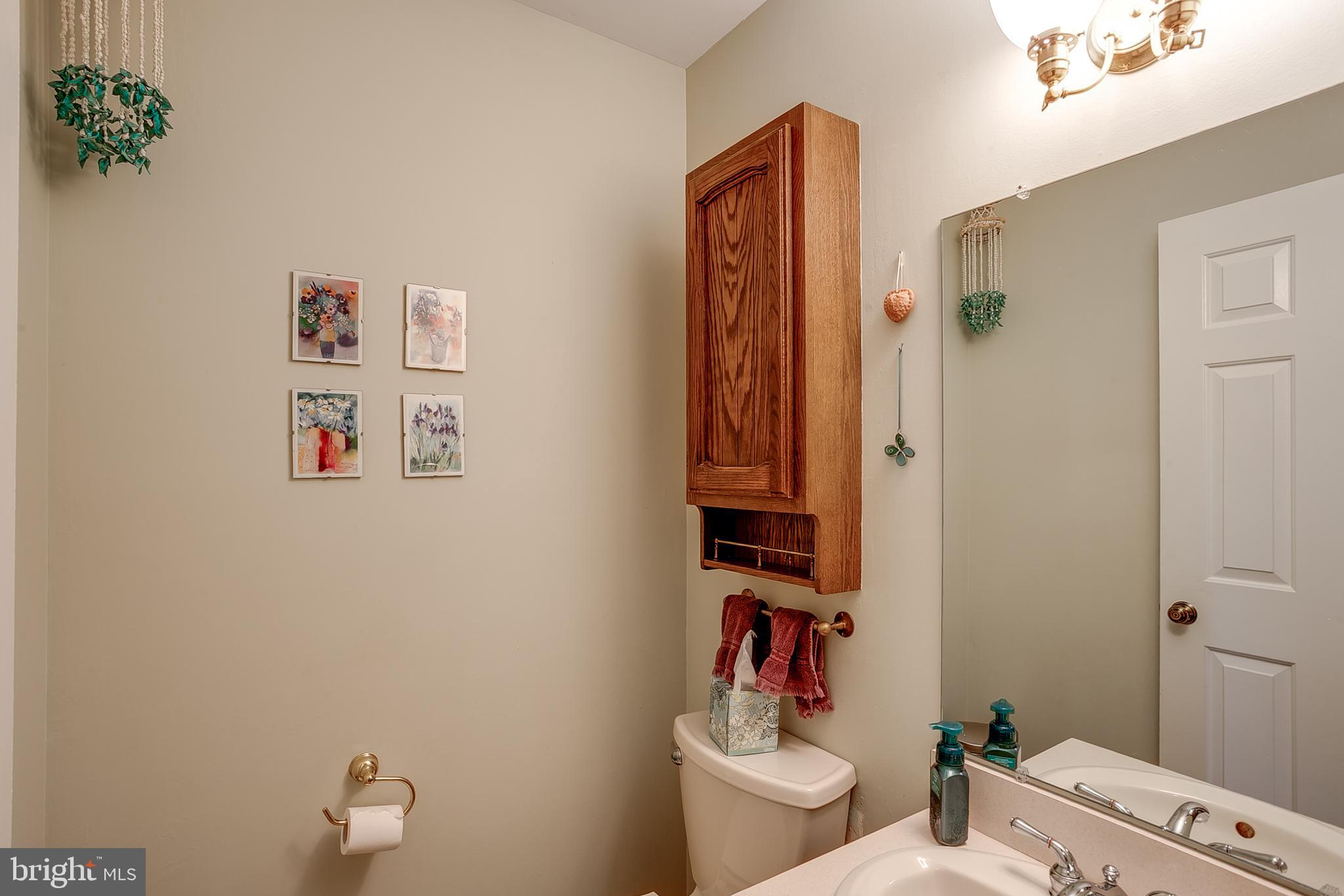 402 Doerrmann Drive Mickleton, NJ 08056 - Photo 14 of 34 a bathroom with a toilet and a shower curtain