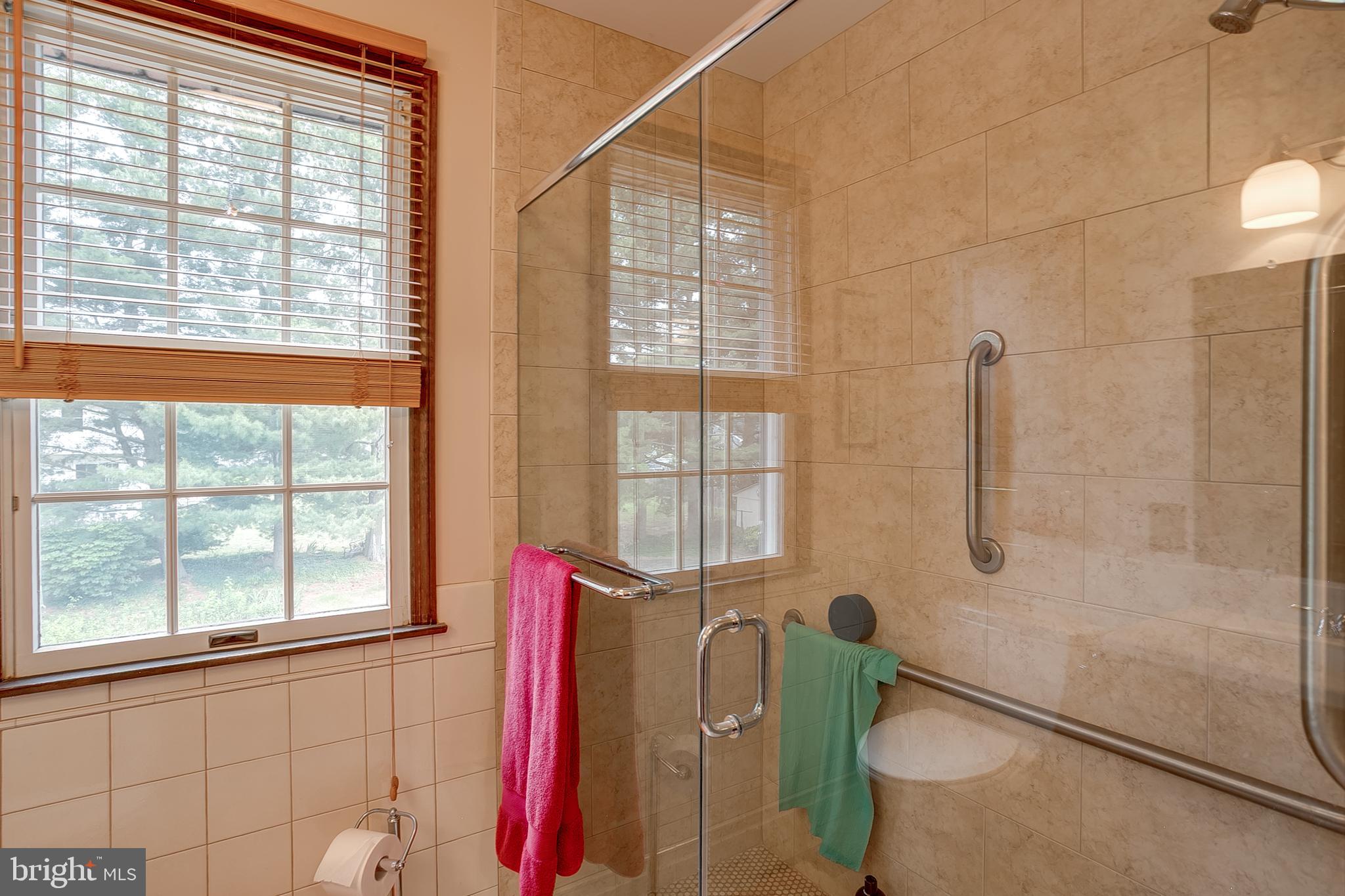 402 Doerrmann Drive Mickleton, NJ 08056 - Photo 20 of 34 a bathroom with a window and a shower
