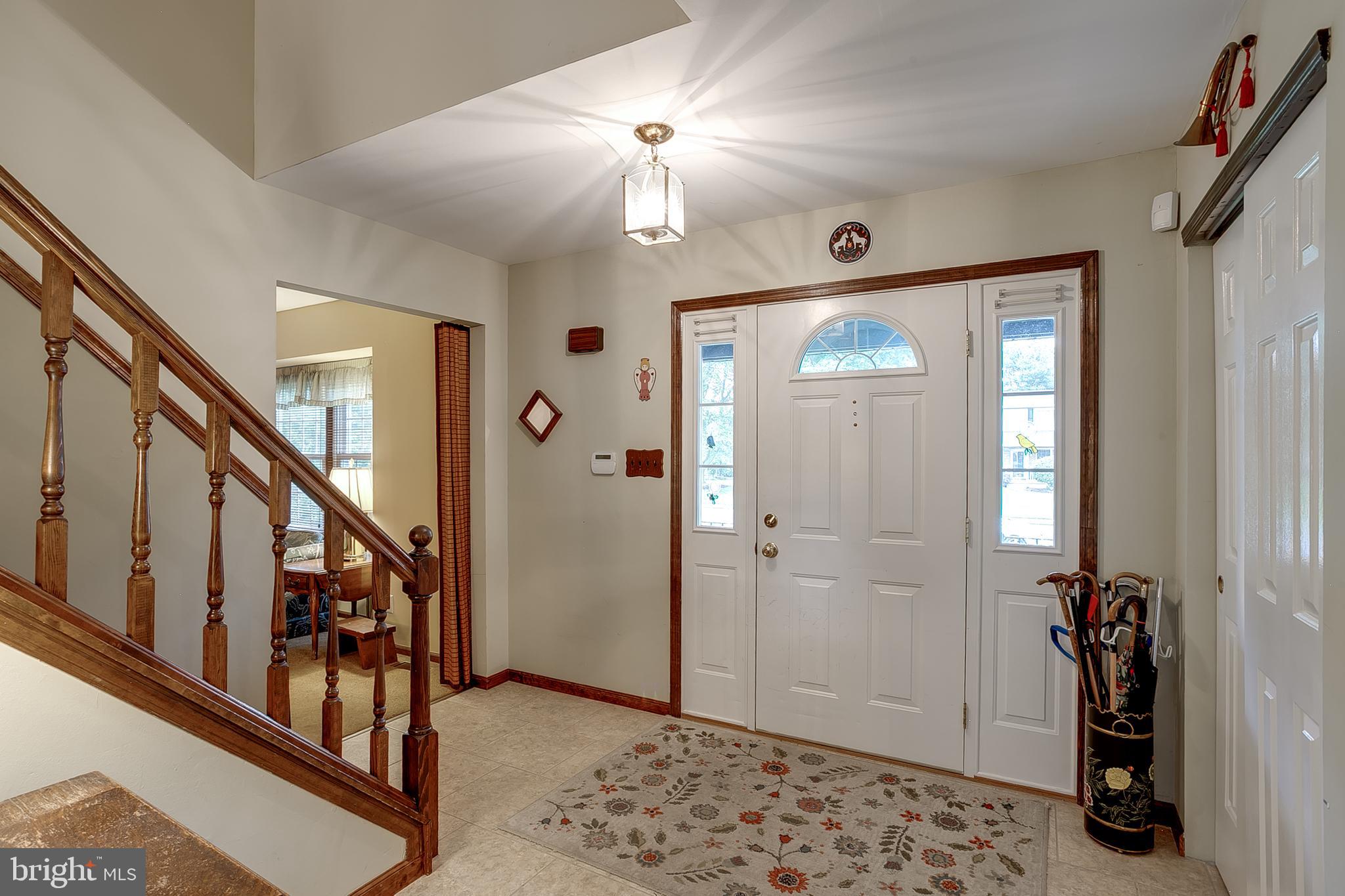 402 Doerrmann Drive Mickleton, NJ 08056 - Photo 2 of 34 a very nice looking hallway with a door and stairs