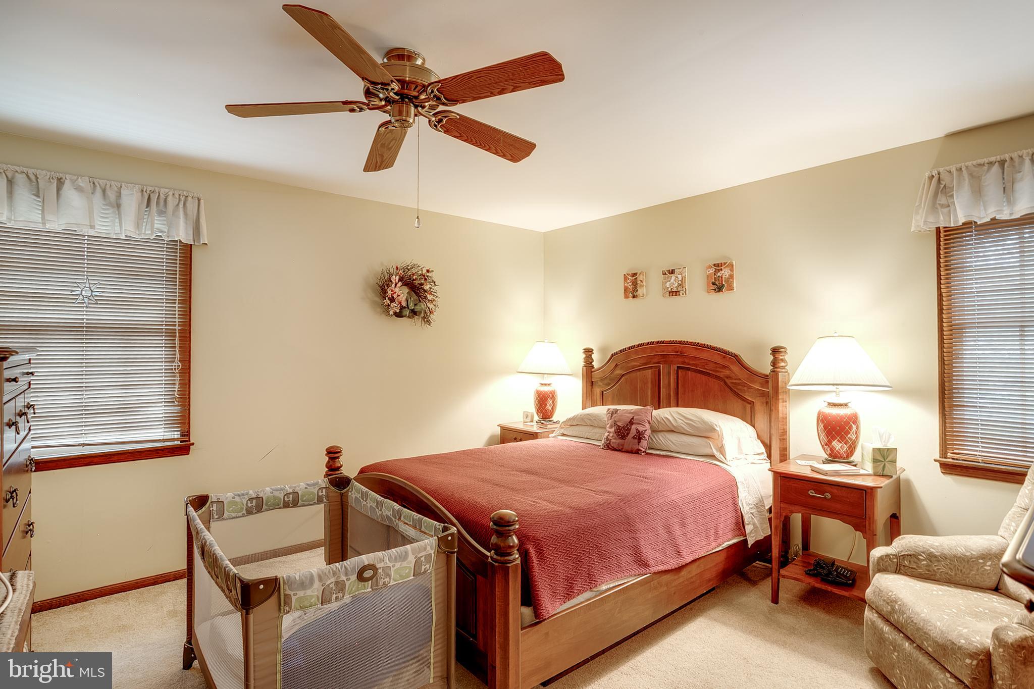 402 Doerrmann Drive Mickleton, NJ 08056 - Photo 21 of 34 a bedroom with a bed and a chair