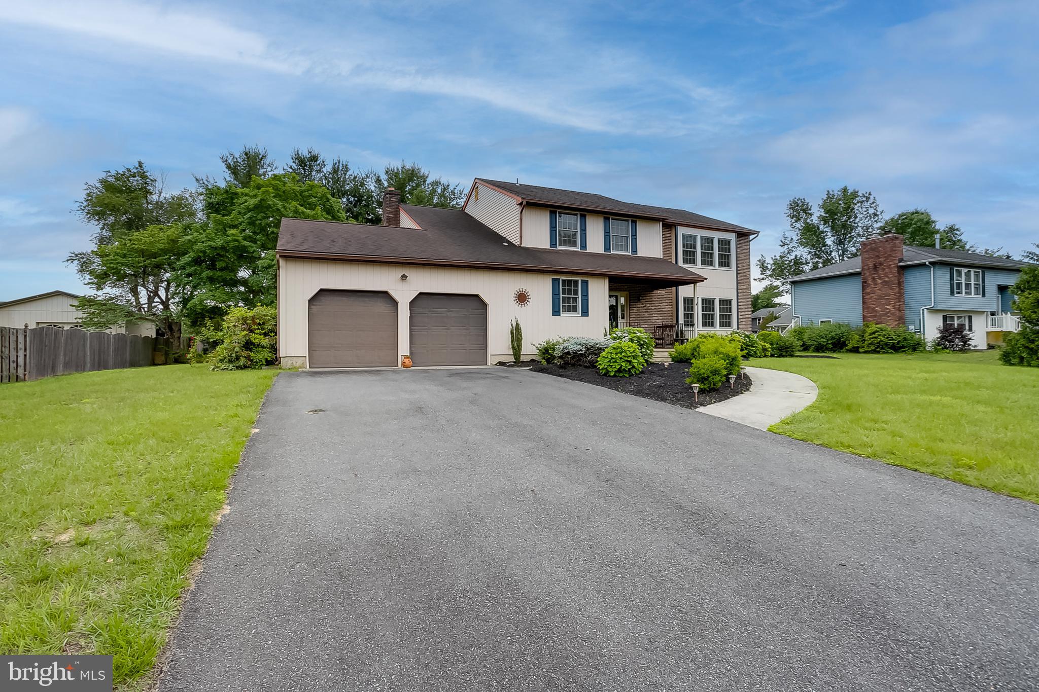 402 Doerrmann Drive Mickleton, NJ 08056 - Photo 28 of 34 a front view of a house with a yard and potted plants