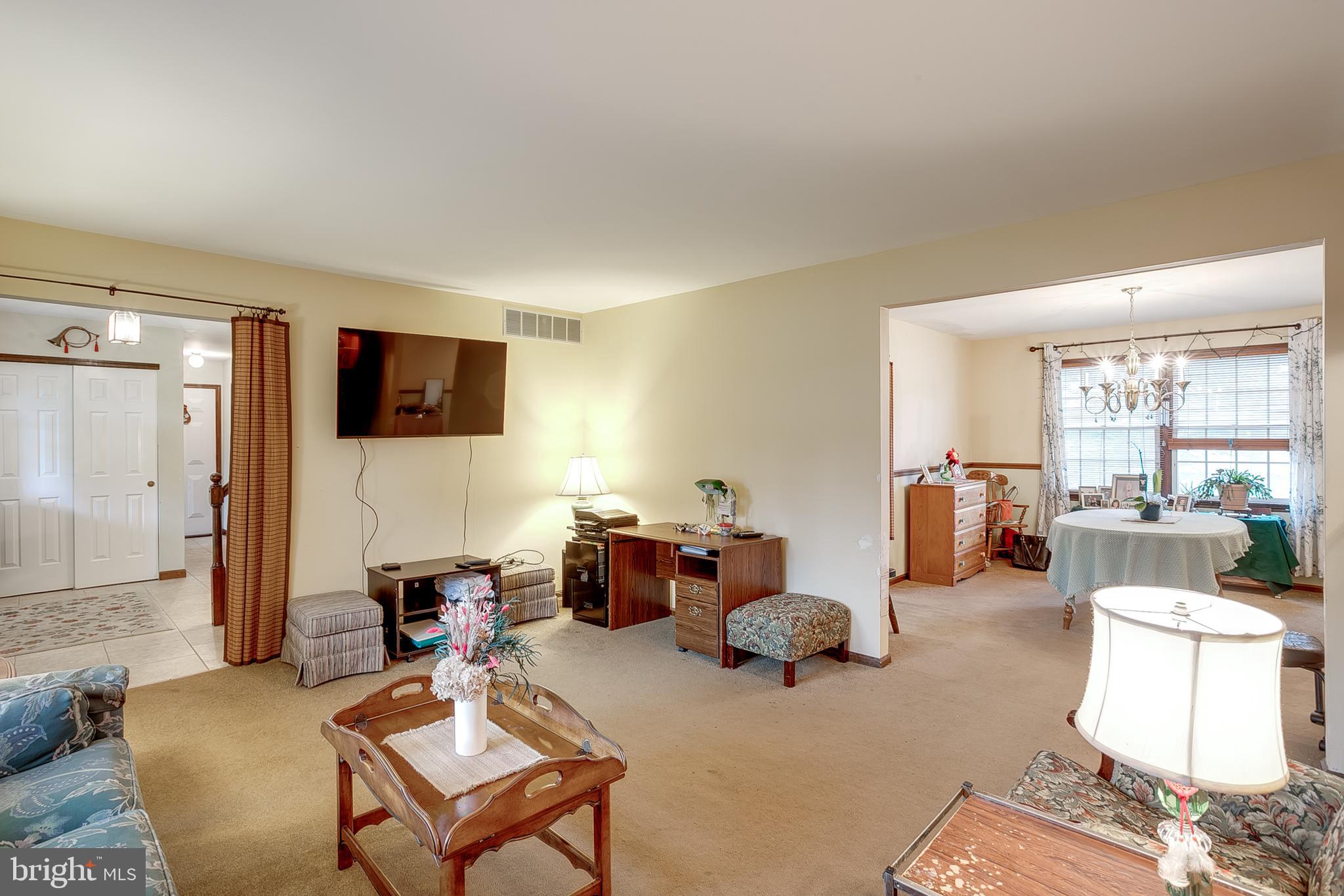402 Doerrmann Drive Mickleton, NJ 08056 - Photo 4 of 34 a living room with furniture and a flat screen tv