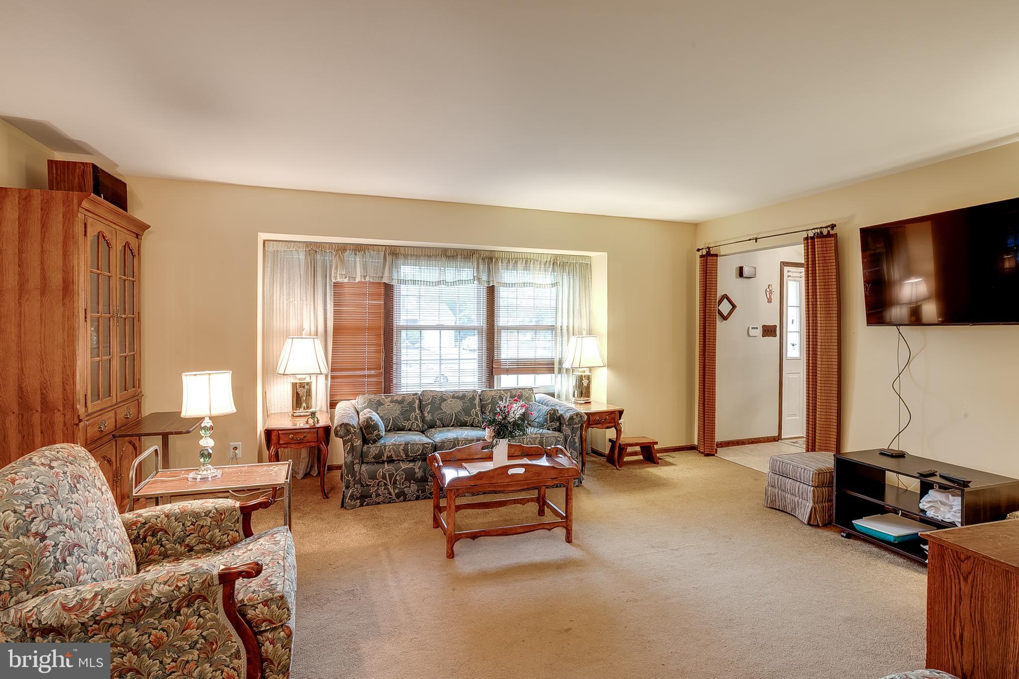 402 Doerrmann Drive Mickleton, NJ 08056 - Photo 5 of 34 a living room with furniture and a flat screen tv